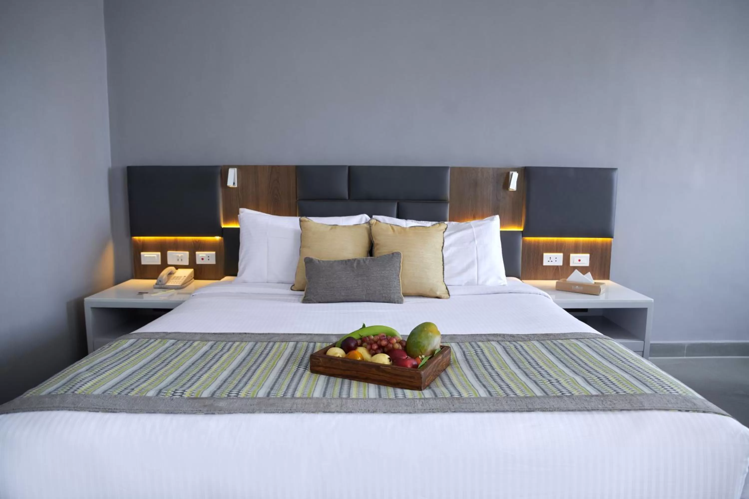 Bed in Sunrise Diamond Beach Resort -Grand Select