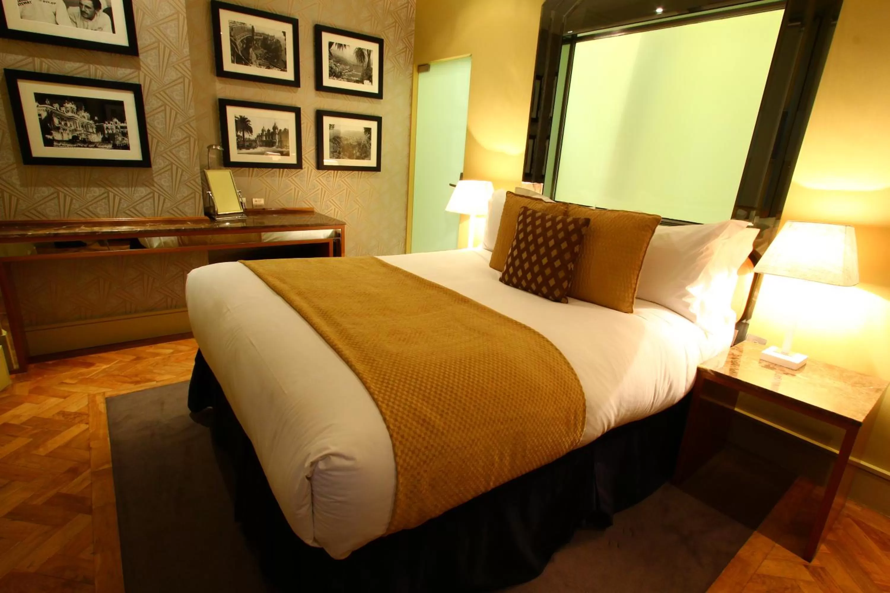 Bed in Le Monde Hotel