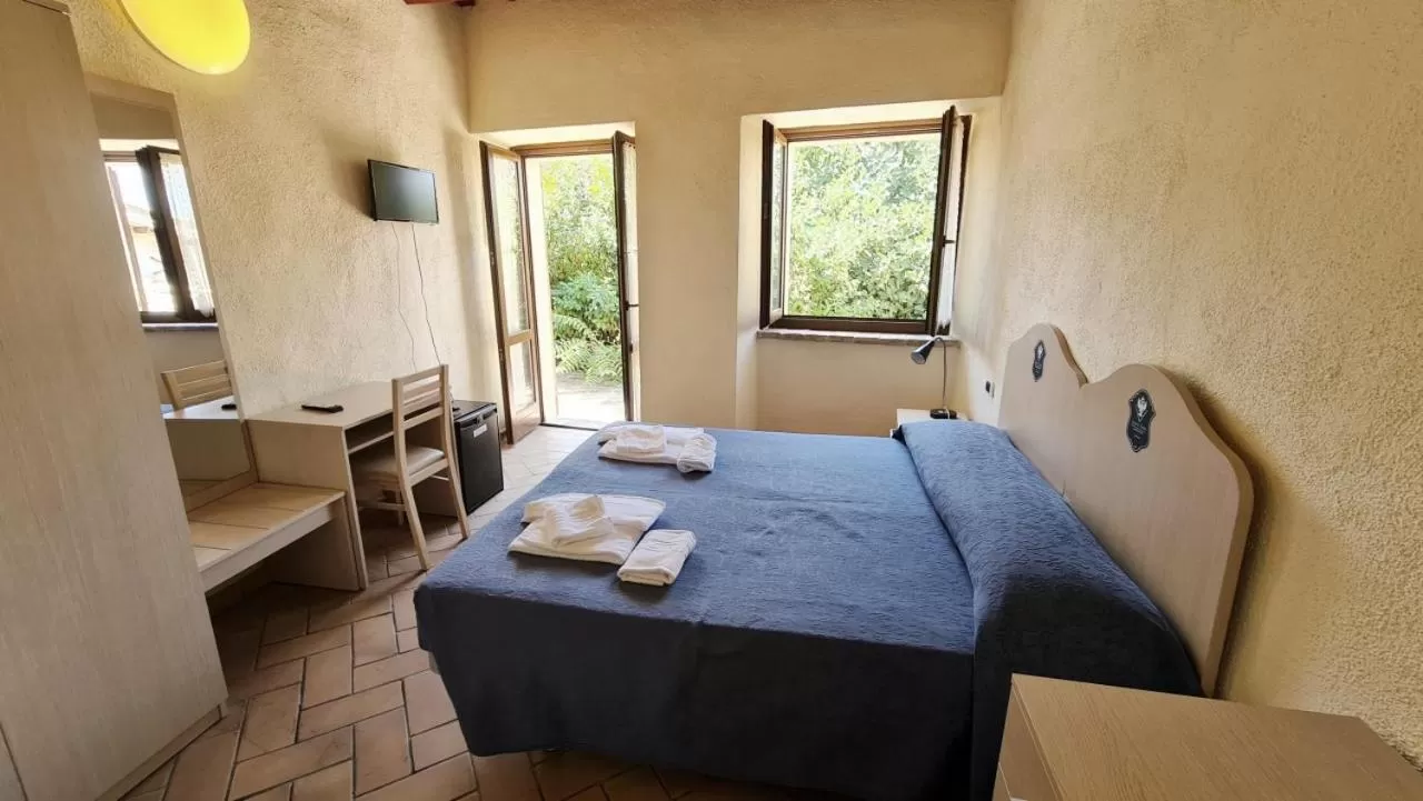 Bed in Borgo de' Varano by Hotel I Duchi