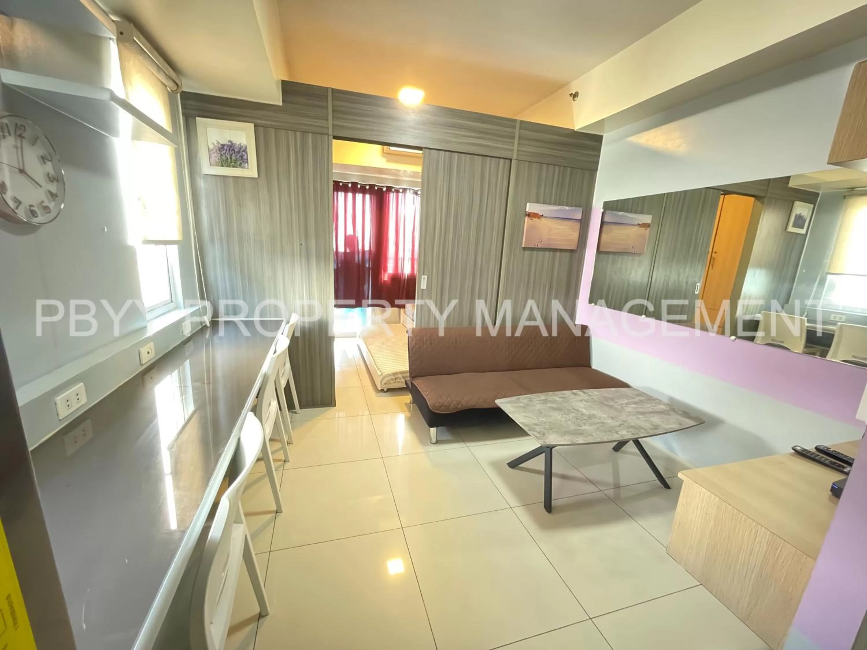 Living room in Green Residences Staycation by PBYY