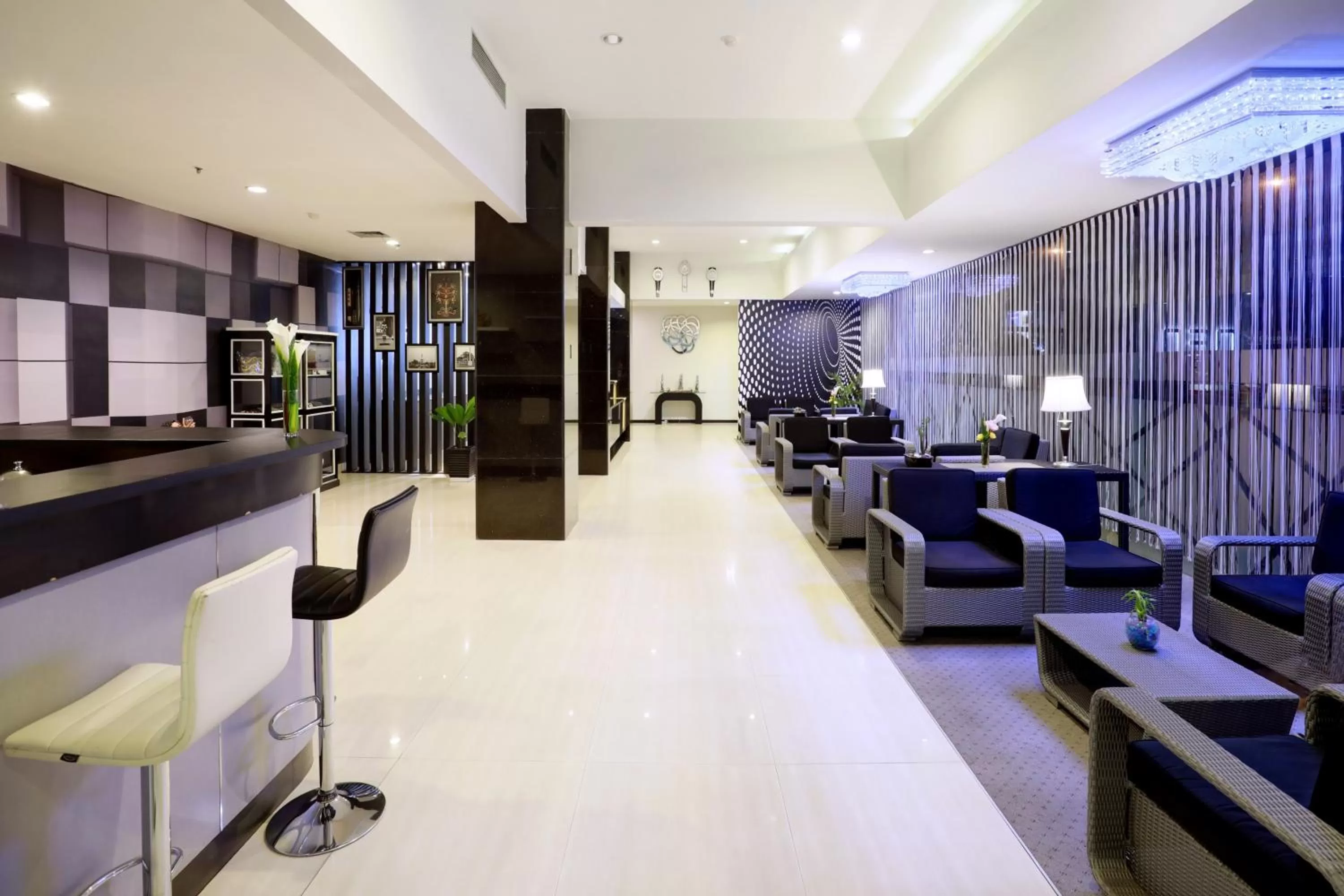 Seating area in Hotel Neo Palma Palangkaraya by ASTON