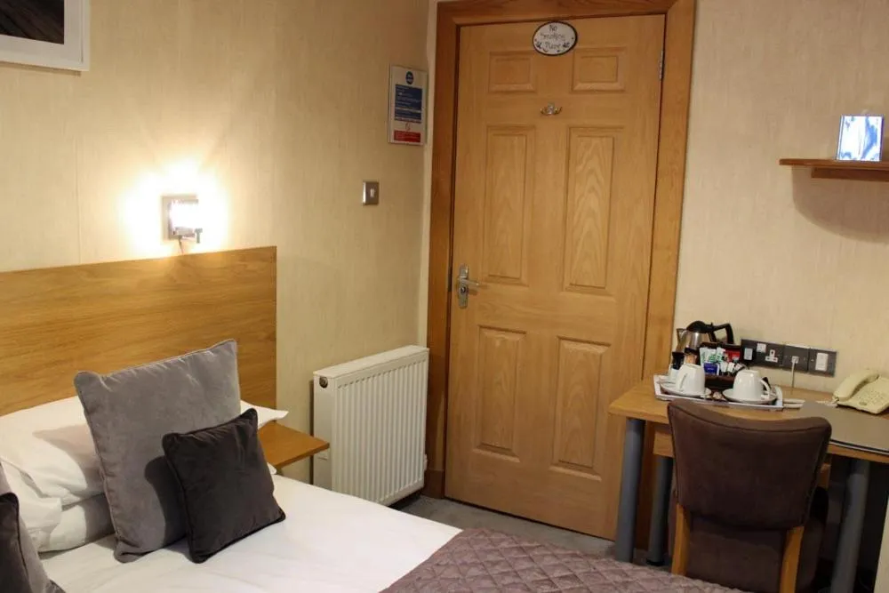 Bed in Station Hotel And Restaurant