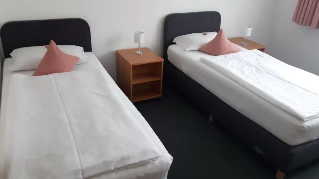 Photo of the whole room, Bed in Hotel-Café-Galerie