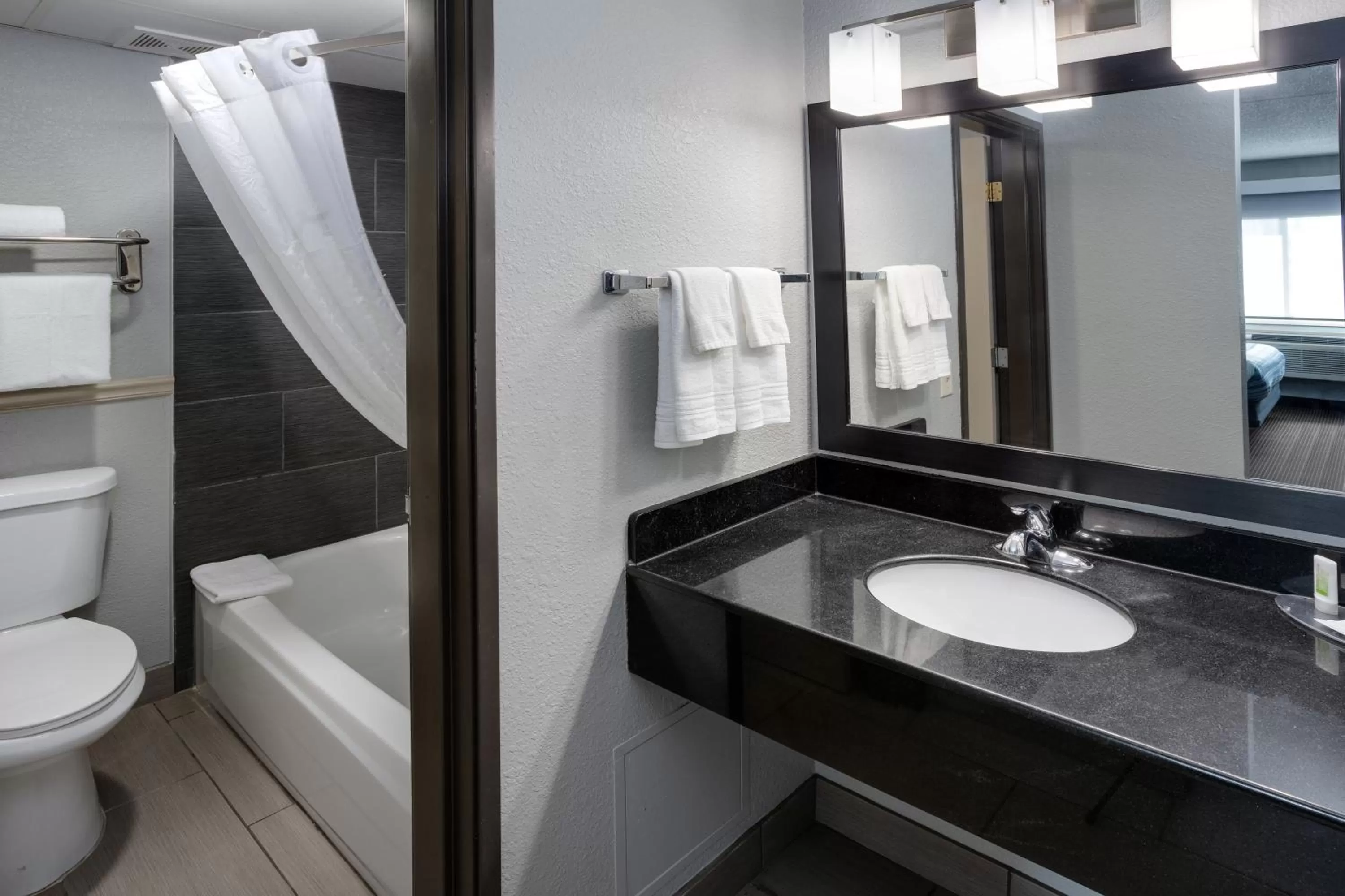 Bathroom in AmericInn by Wyndham Plover Stevens Point