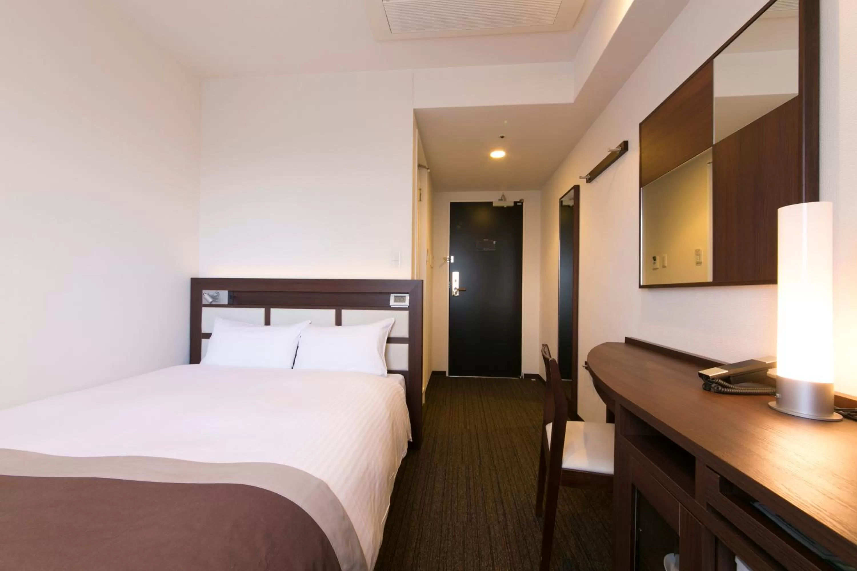 Bed in Urban Hotel Minami Kusatsu