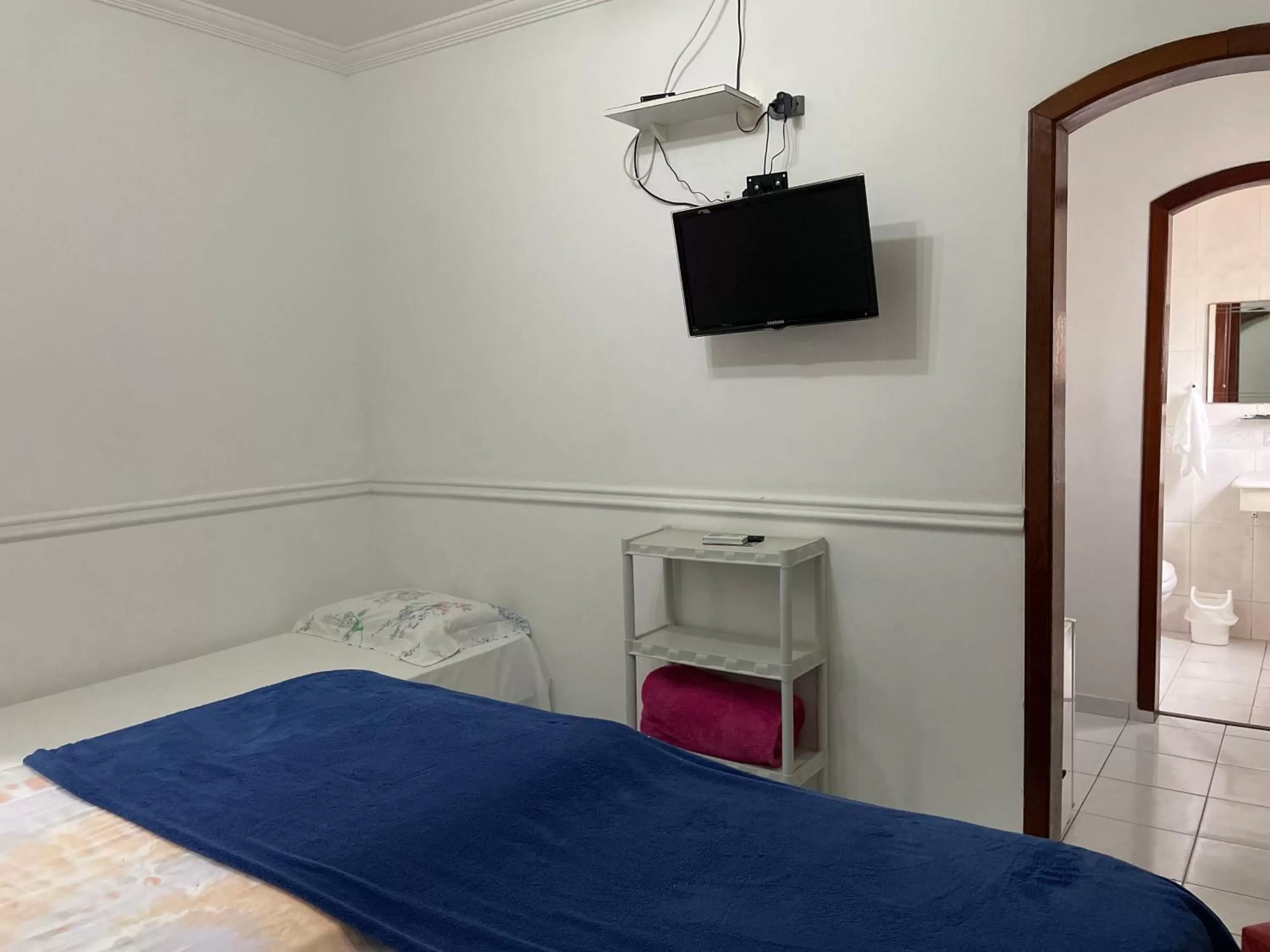 Bed in Pousada Praia do Tombo