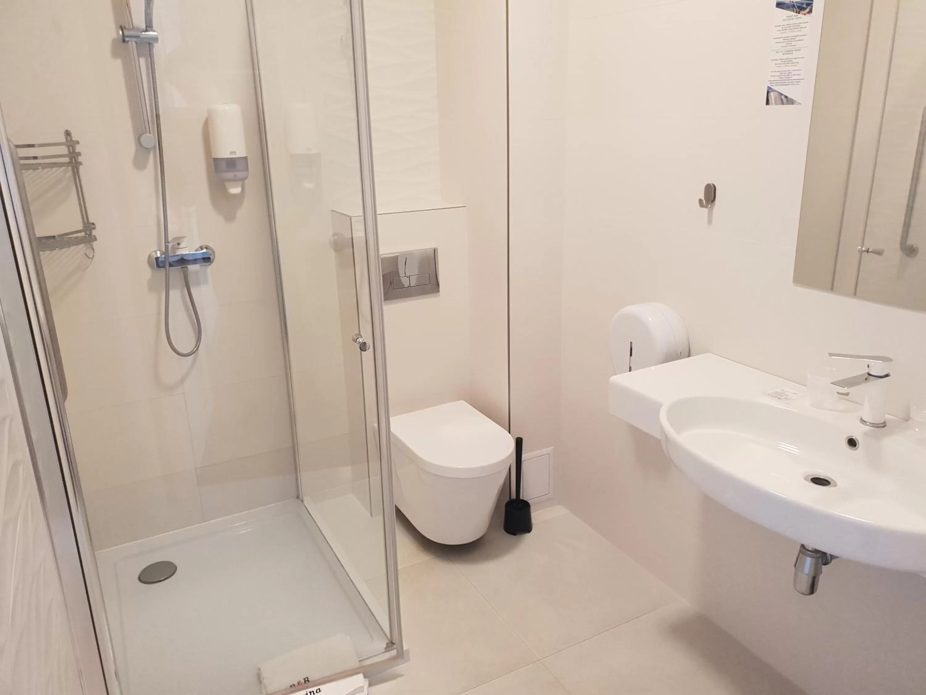 Bathroom in Carina Hotel