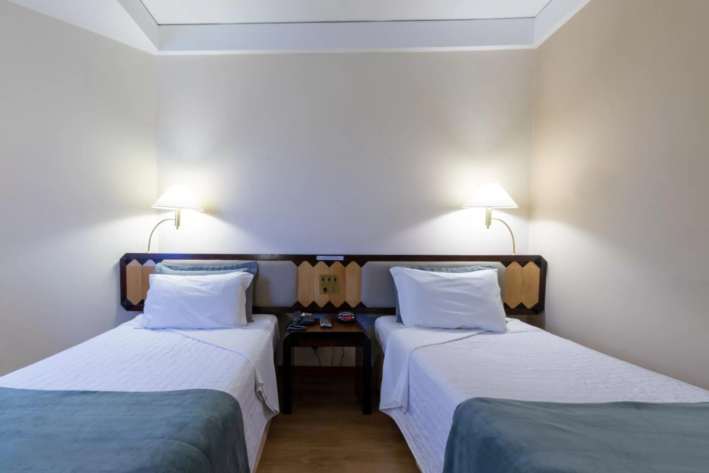 Bed in Golden Tower Pinheiros by Fênix Hotéis