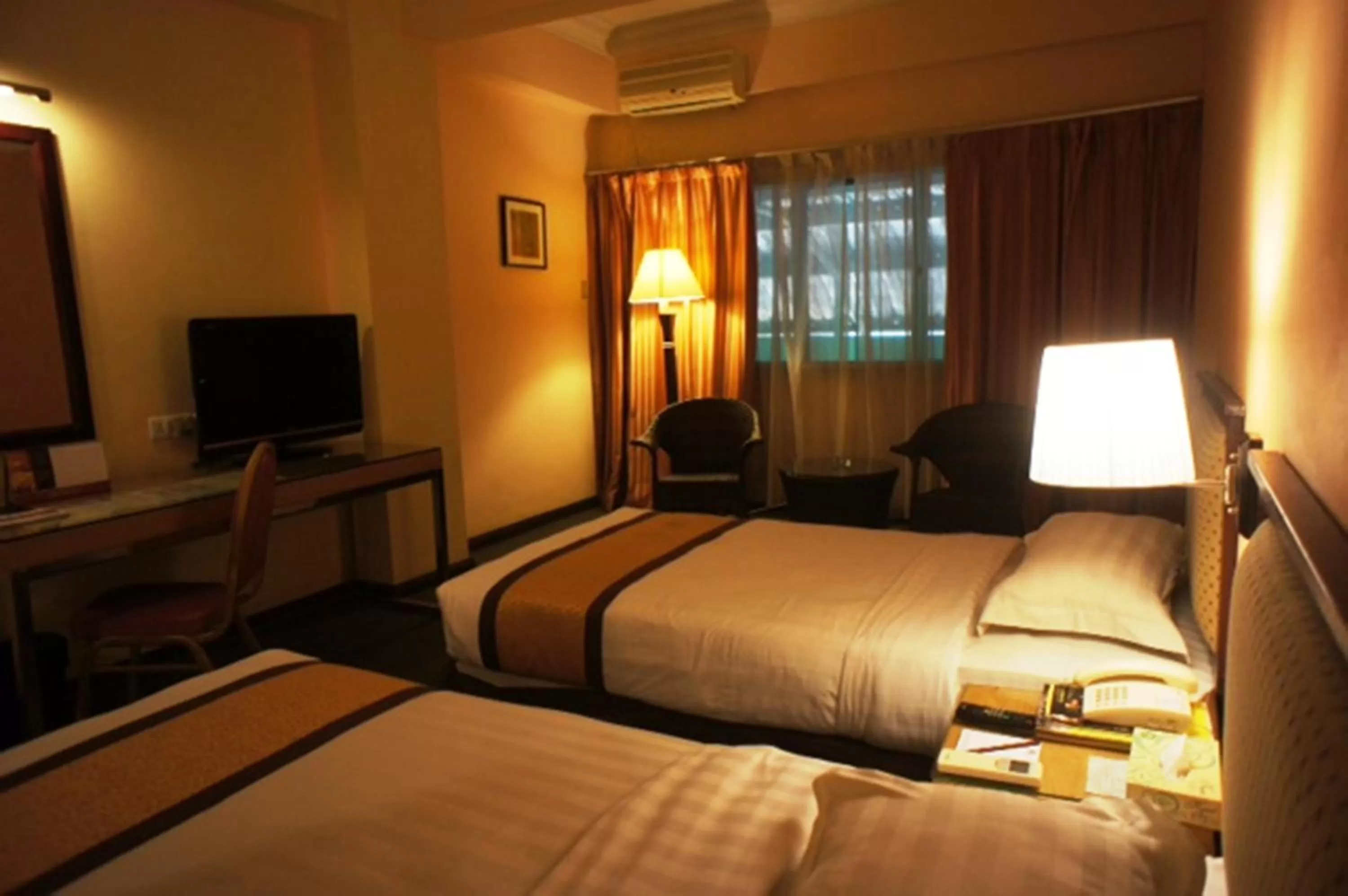 Bed in Tyng Garden Hotel