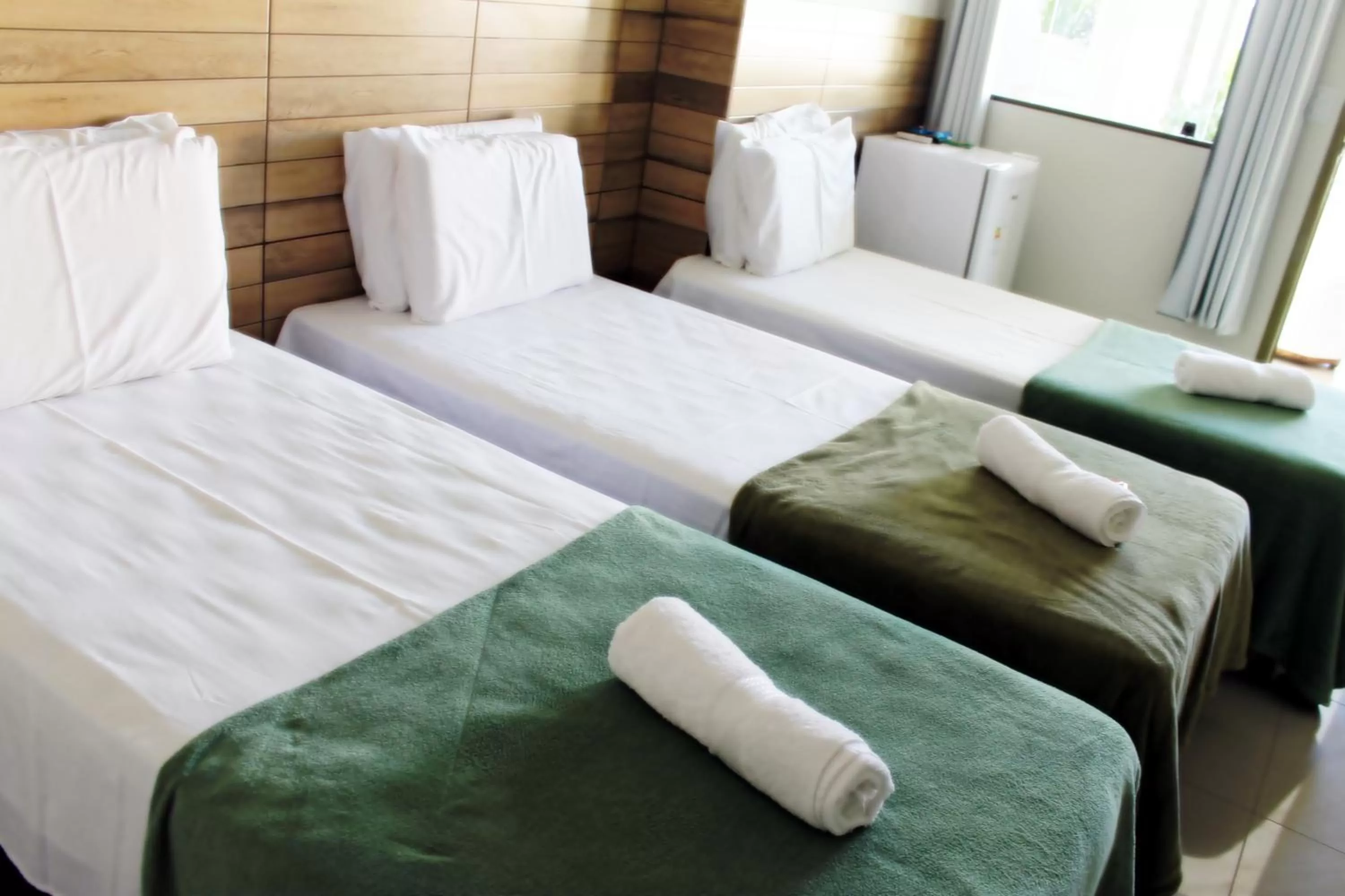 Bed in Pousada Das Palmeiras