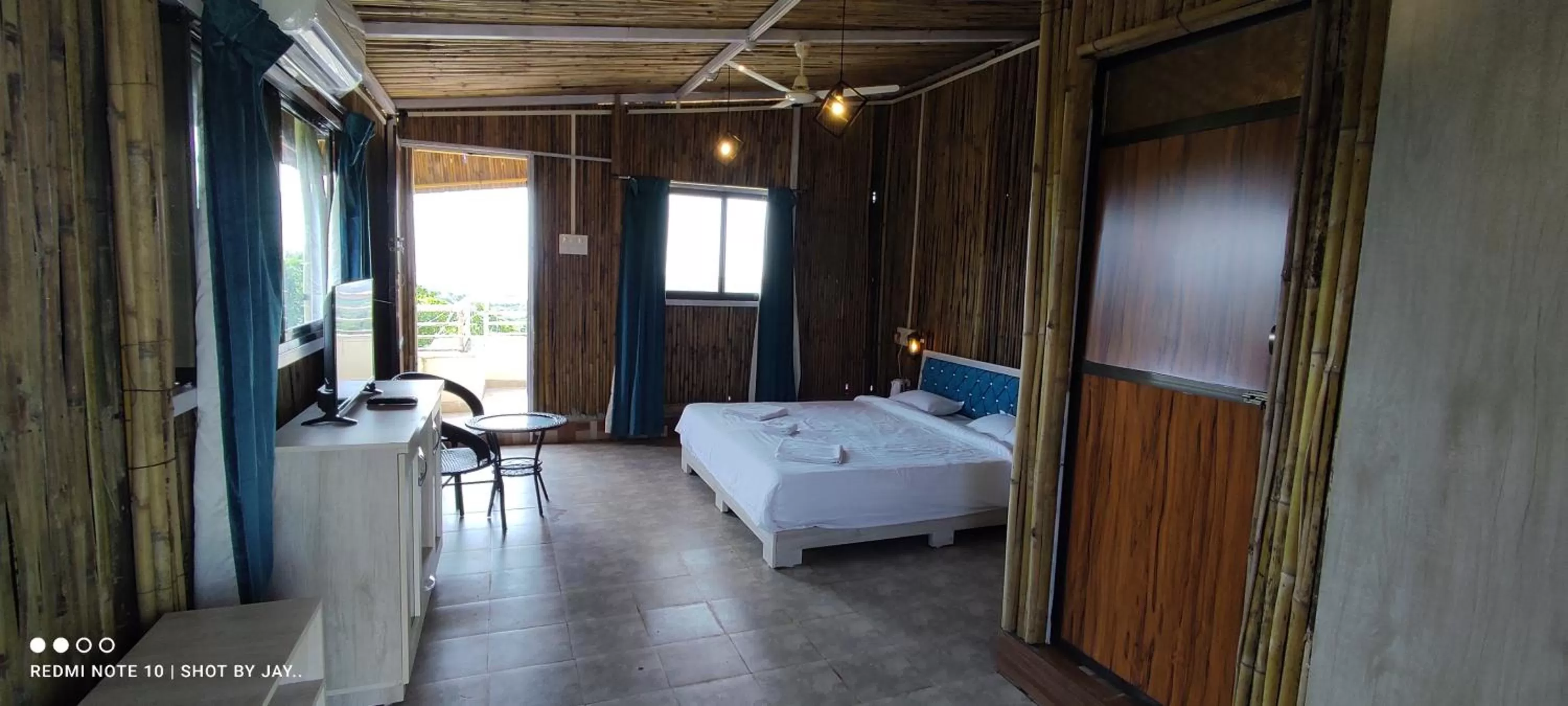 Photo of the whole room, Bed in Mango Valley Resort Ganpatipule