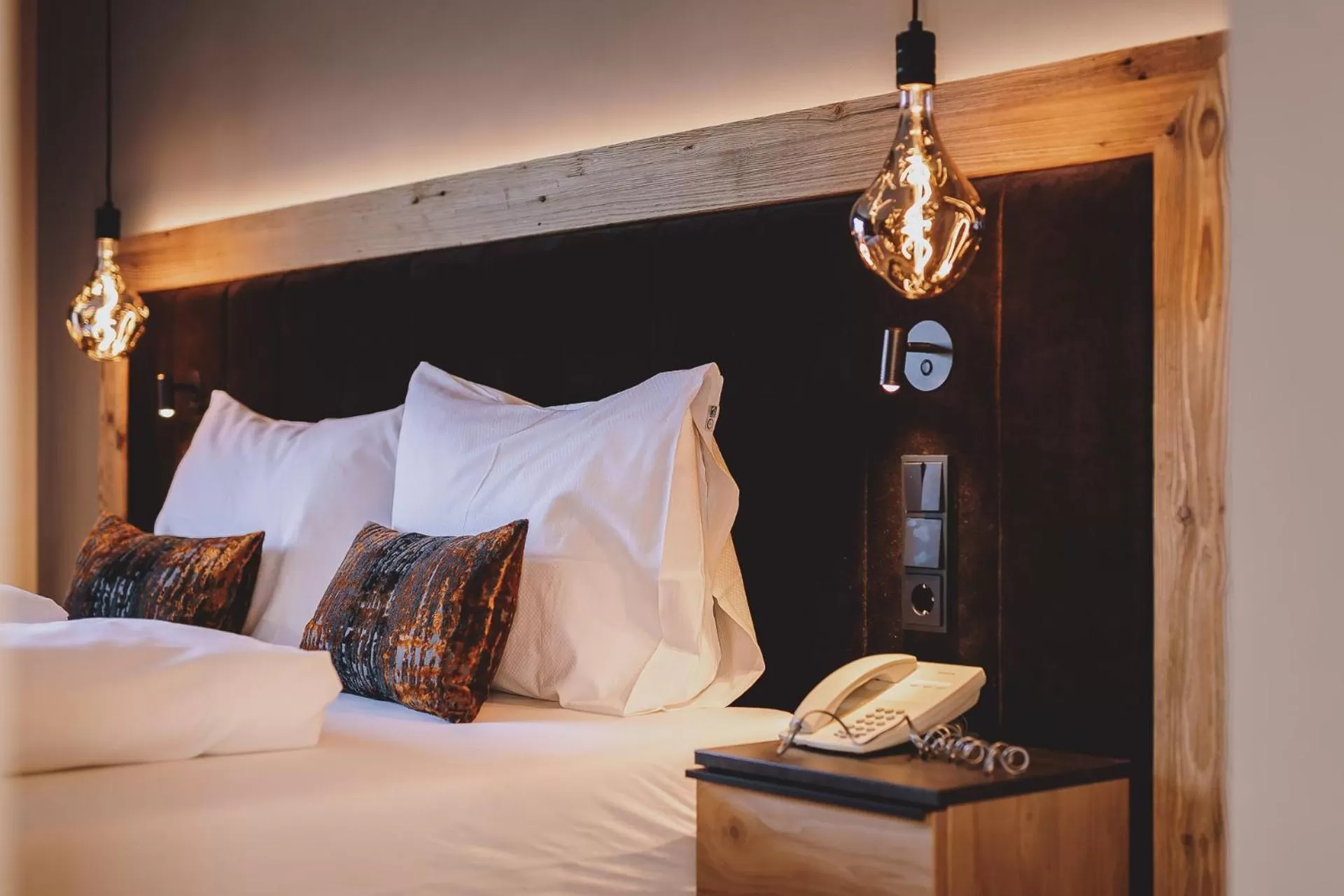 Bed in POST POST Hotel - Alpine Boutique Hotel & Spa