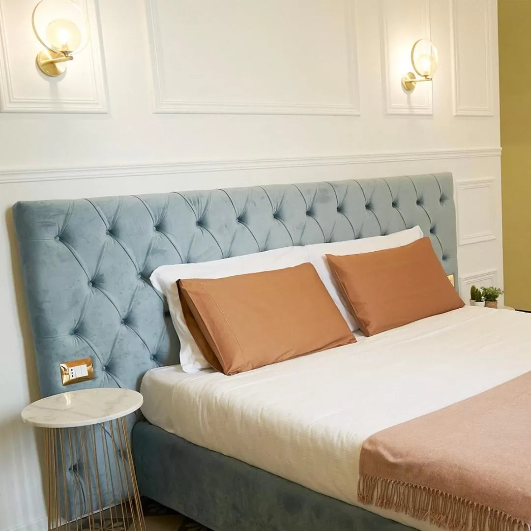 Bed in Toscano Palace Luxury Rooms Catania