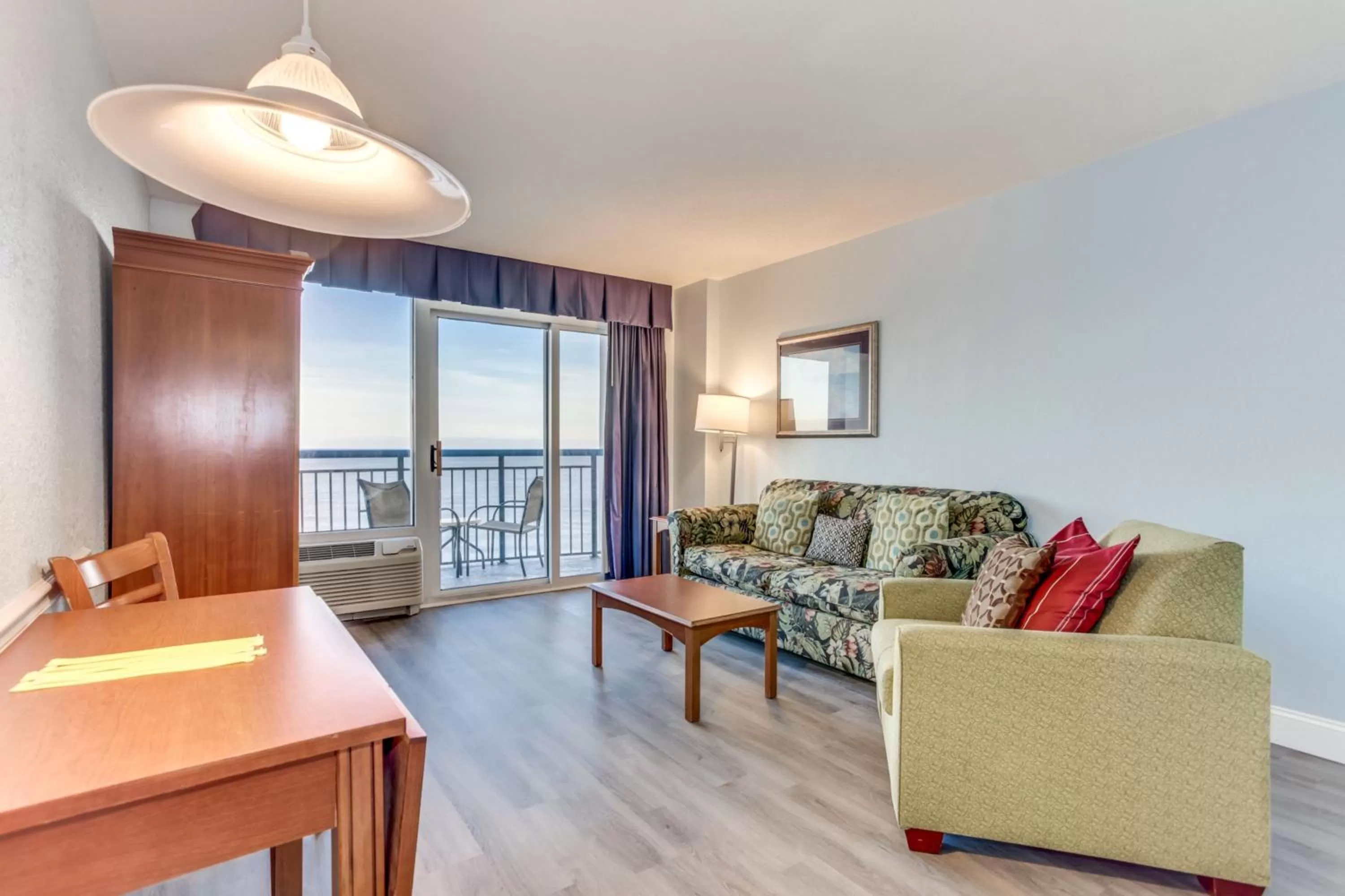 Living room, Seating Area in Boardwalk Beach Resort Condo w Oceanfront Balcony