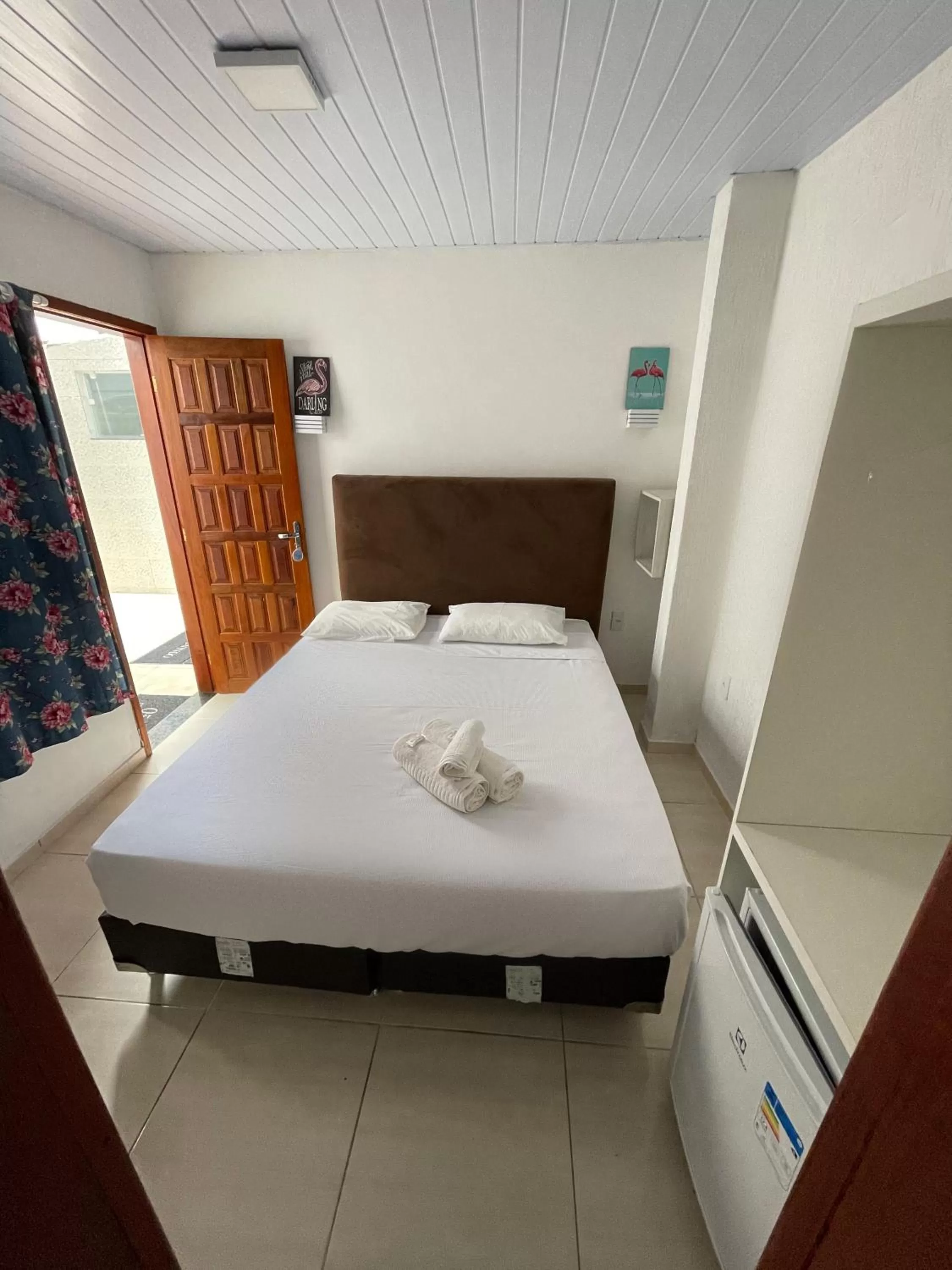 Bed in Flamingo Beach Pousada