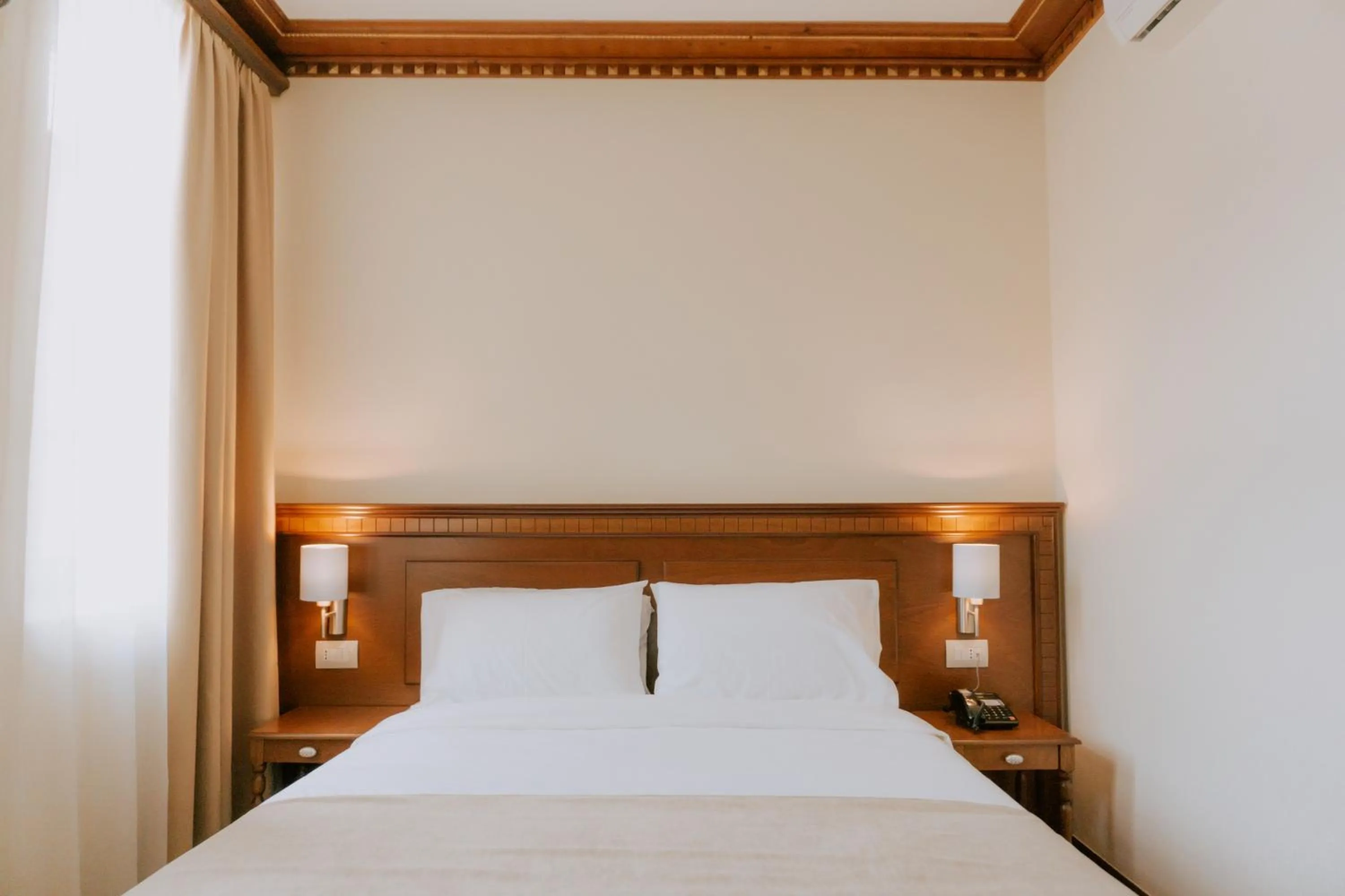 Bed in Hotel Argjiro