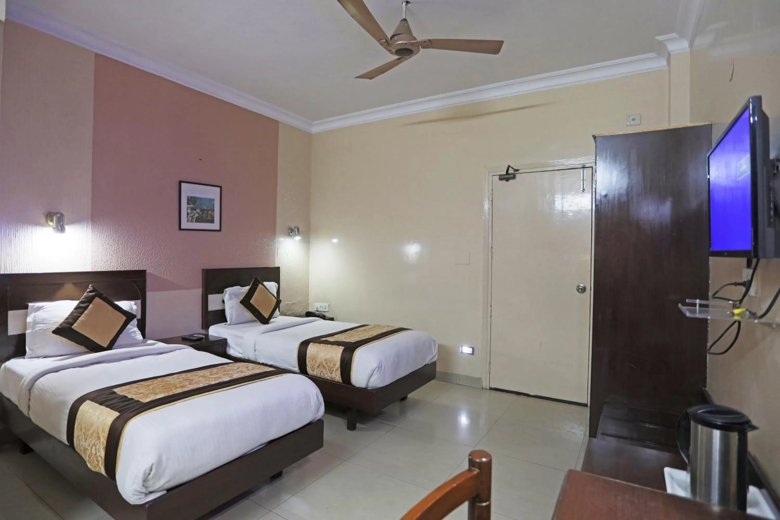 Photo of the whole room in Hotel The Tourist - 1 min from New Delhi Railway Station