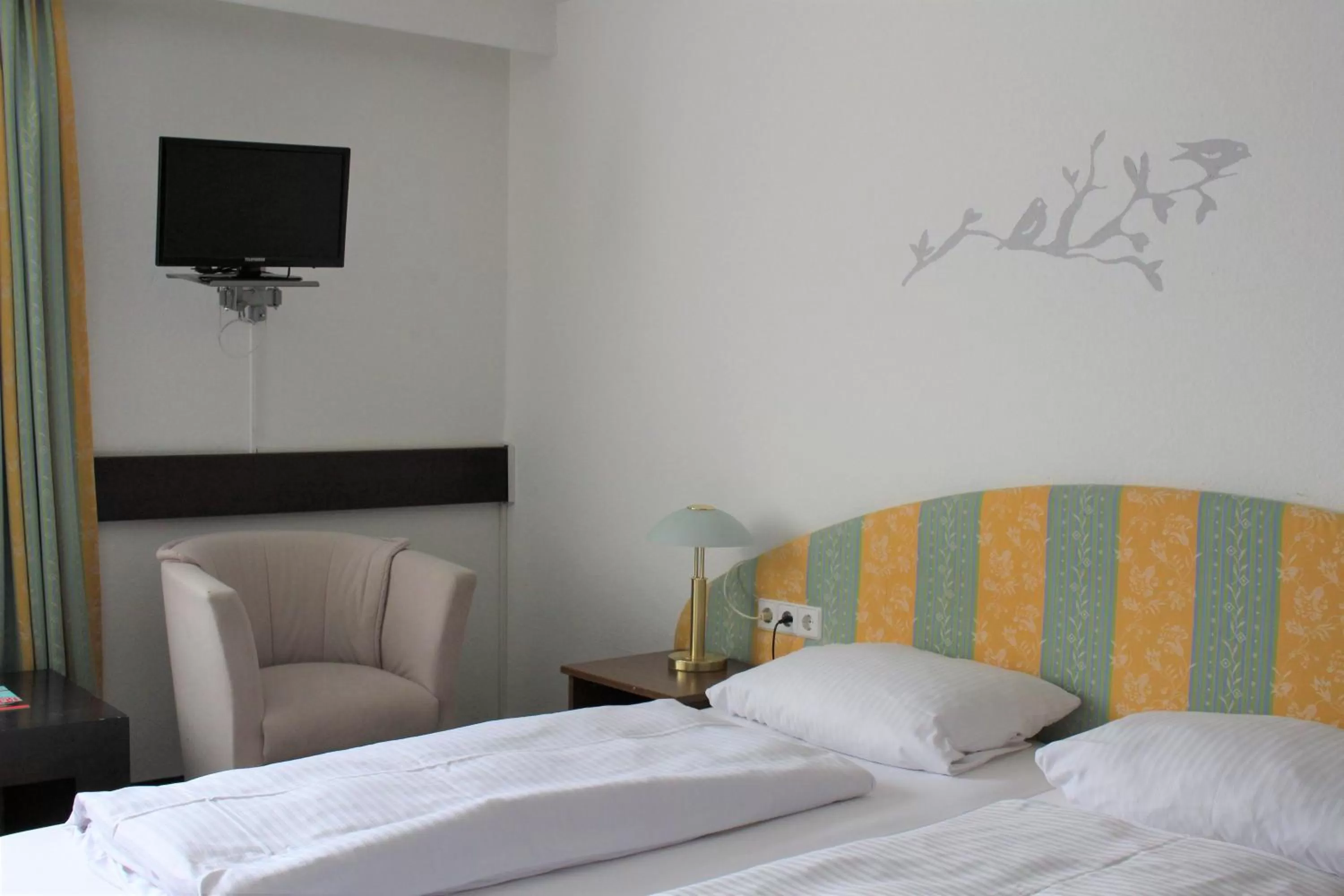 Bed in Hotel Ulmer Spatz