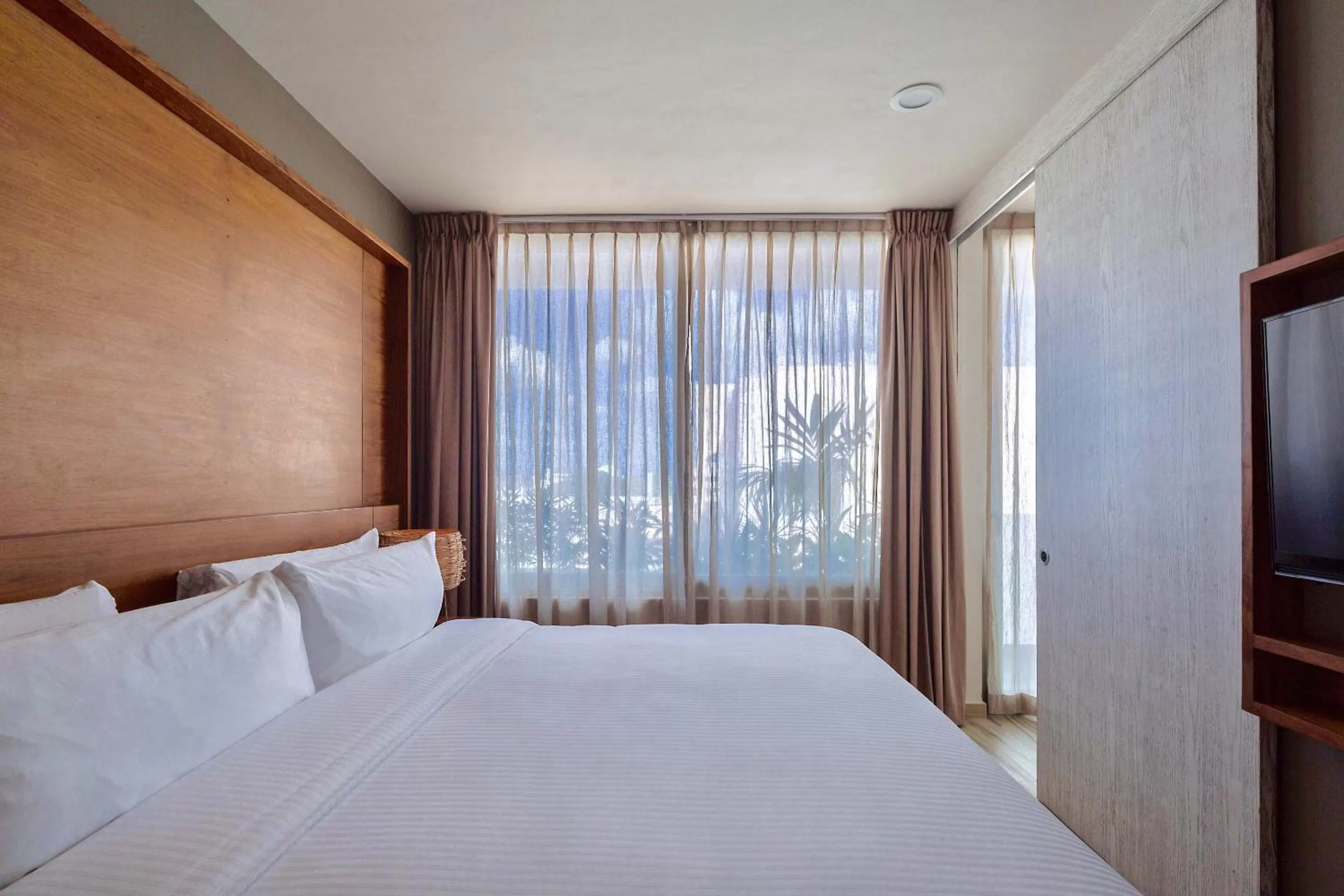 Bed in Newport House Playa Boutique Hotel