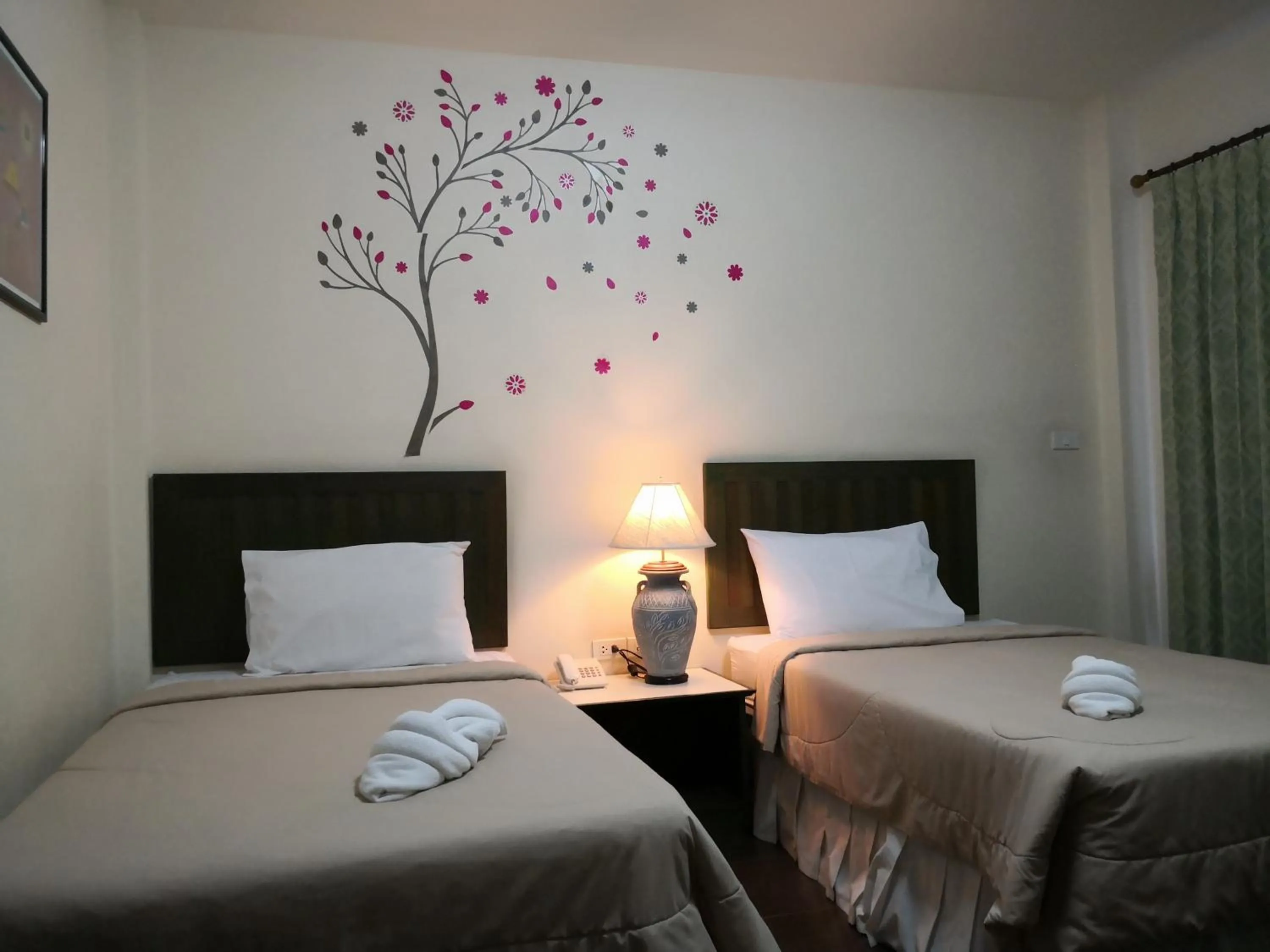 Bed in Baan Suksiri Hotel