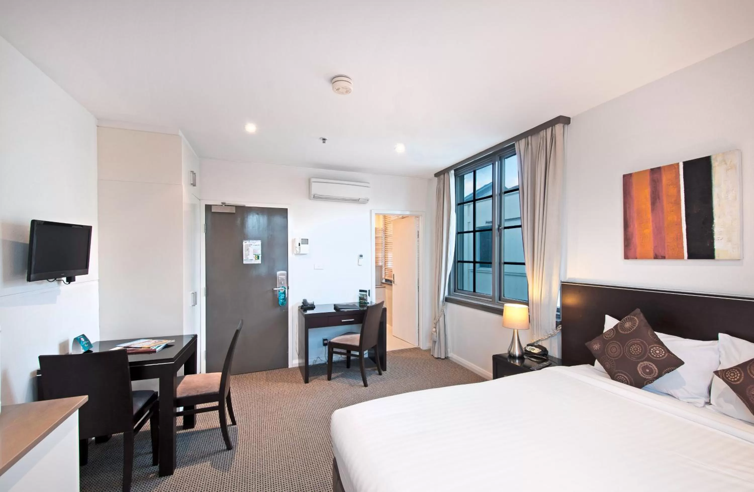 Photo of the whole room, Bed in Quest Canberra