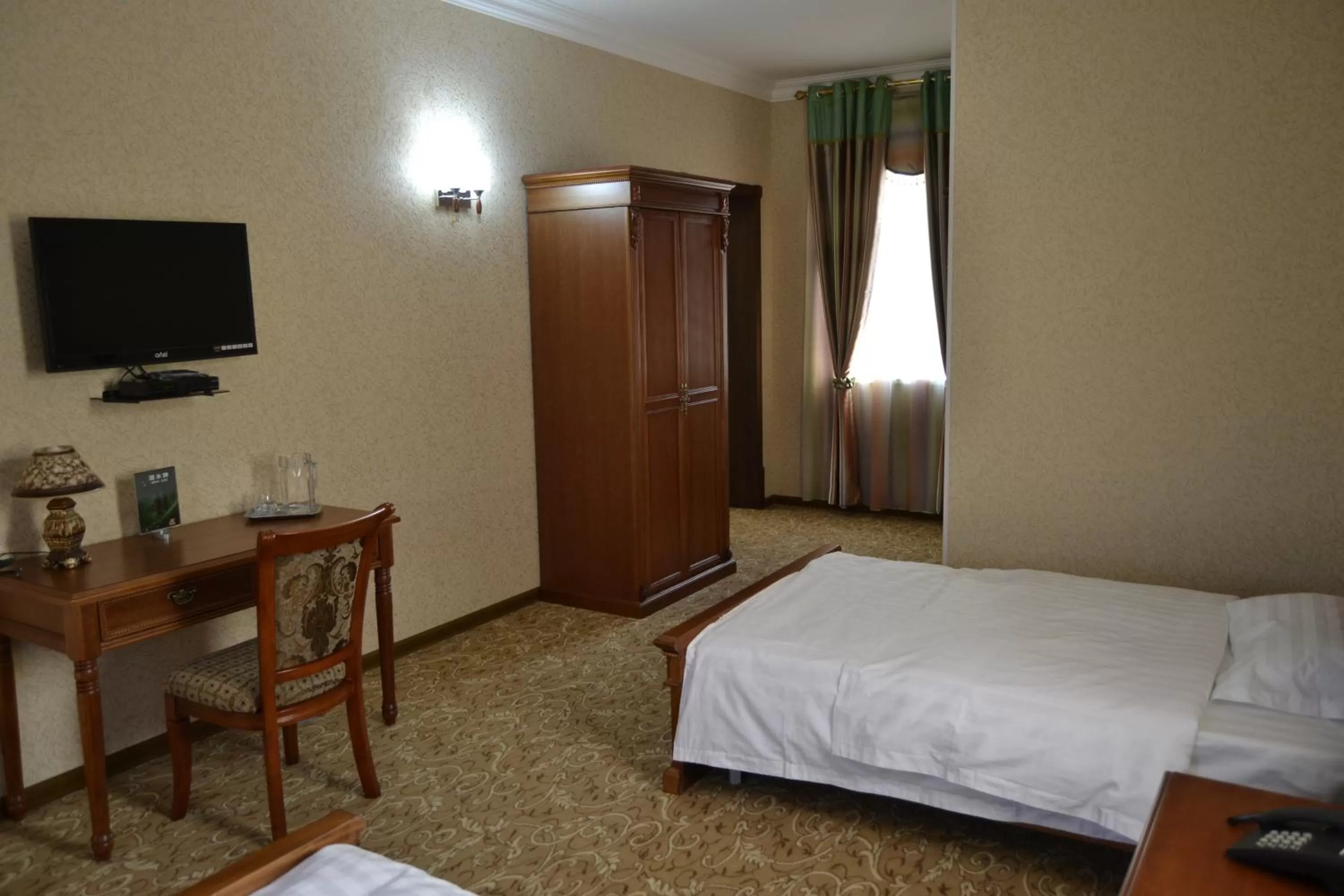 Bed in Maximum Hotel