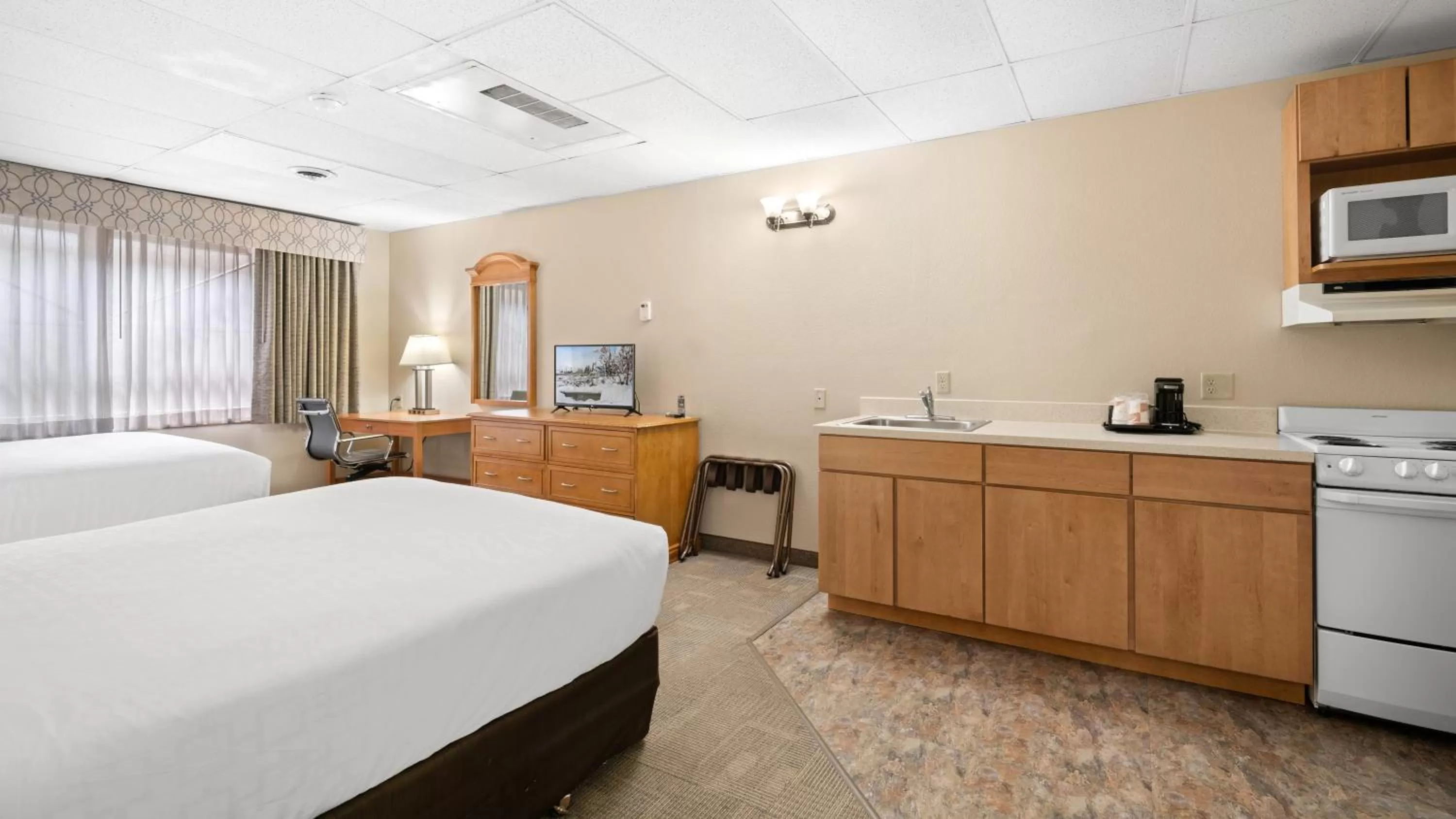 Photo of the whole room, Bed in Clarion Hotel & Suites Fairbanks near Ft Wainwright