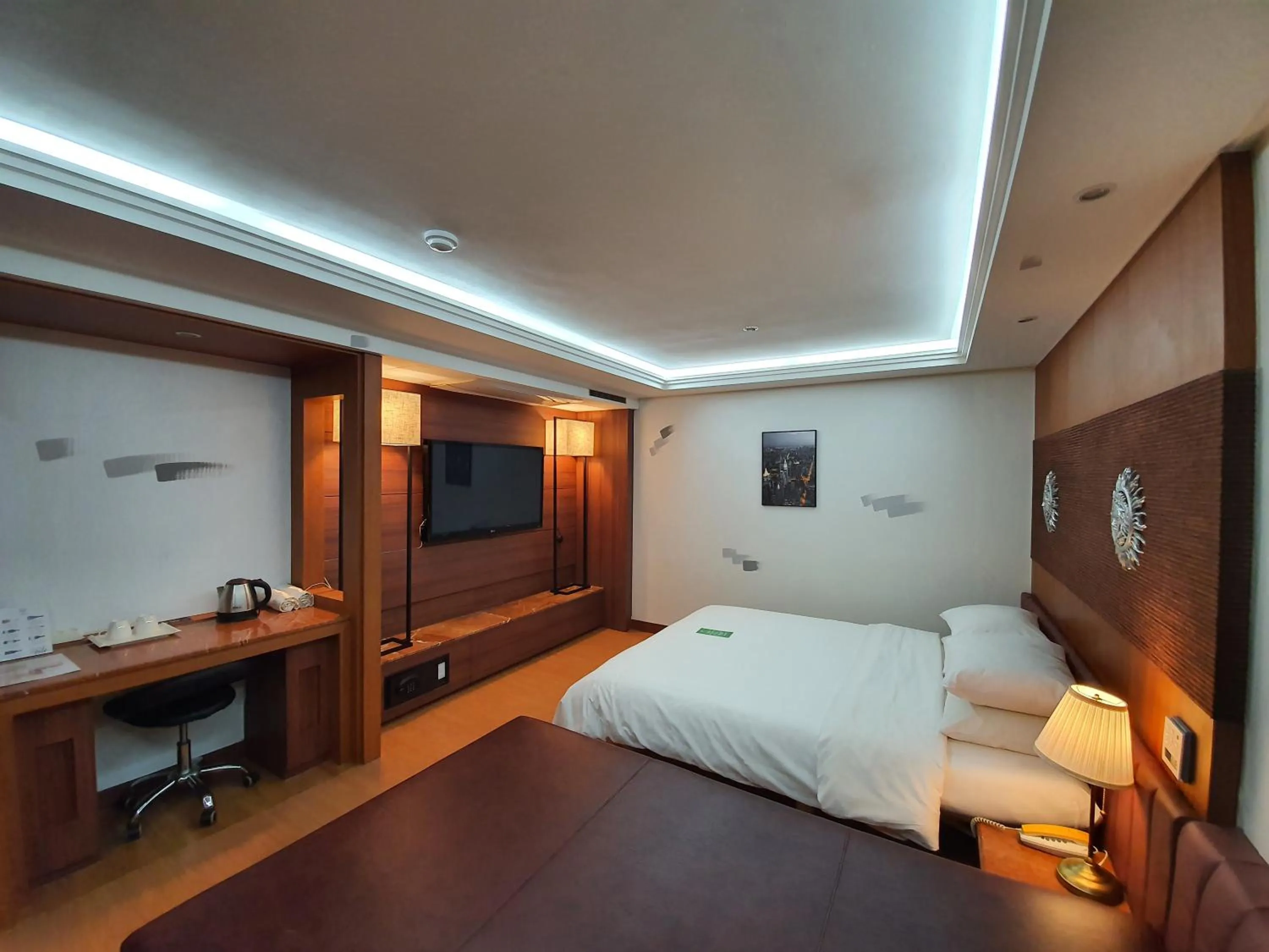 Bed in Friendly DH Naissance Hotel by Mindrum Group