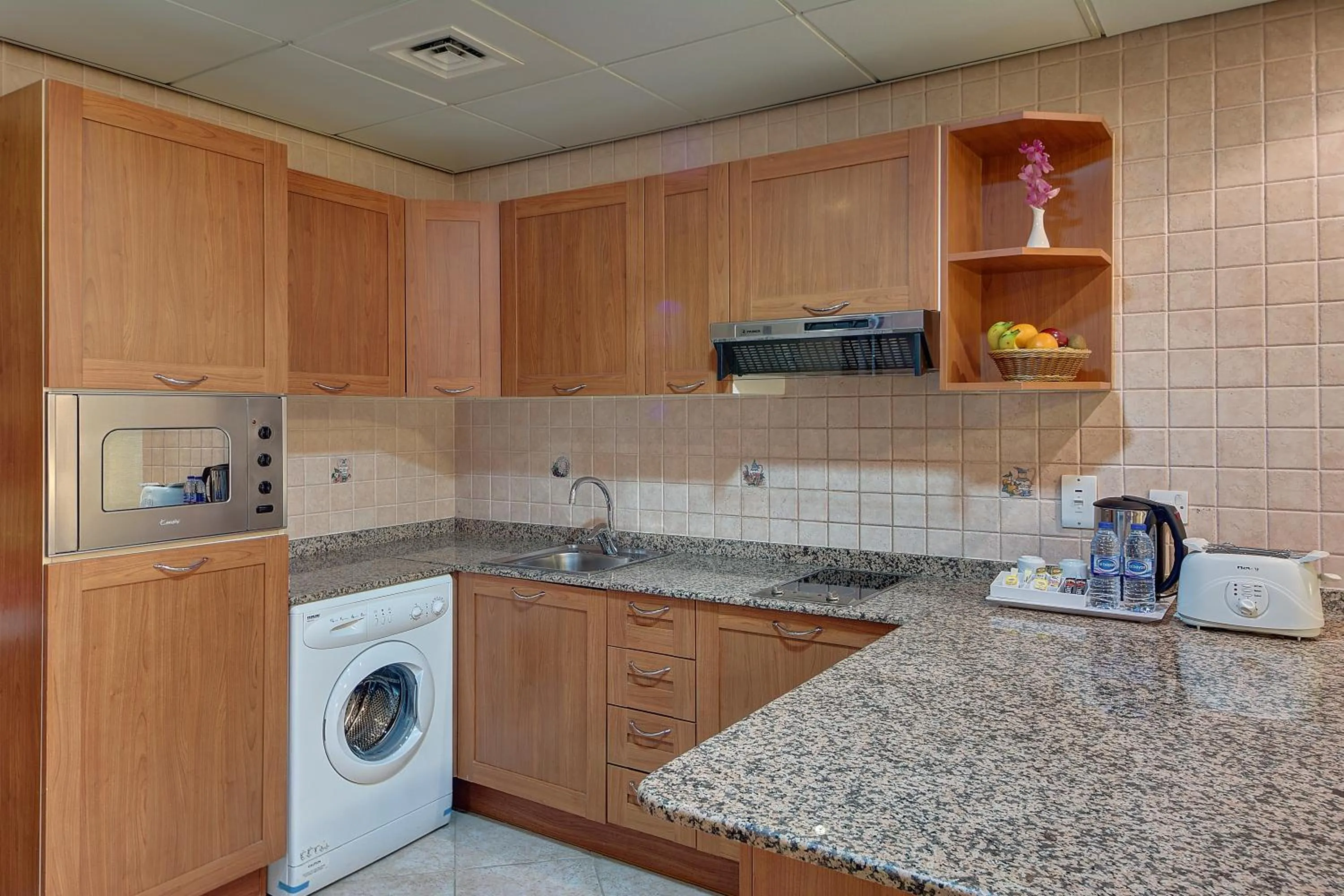 Kitchen or kitchenette in Al Manar Grand Hotel Apartment