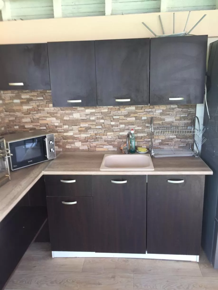 Kitchen/Kitchenette in Family Hotel Malibu