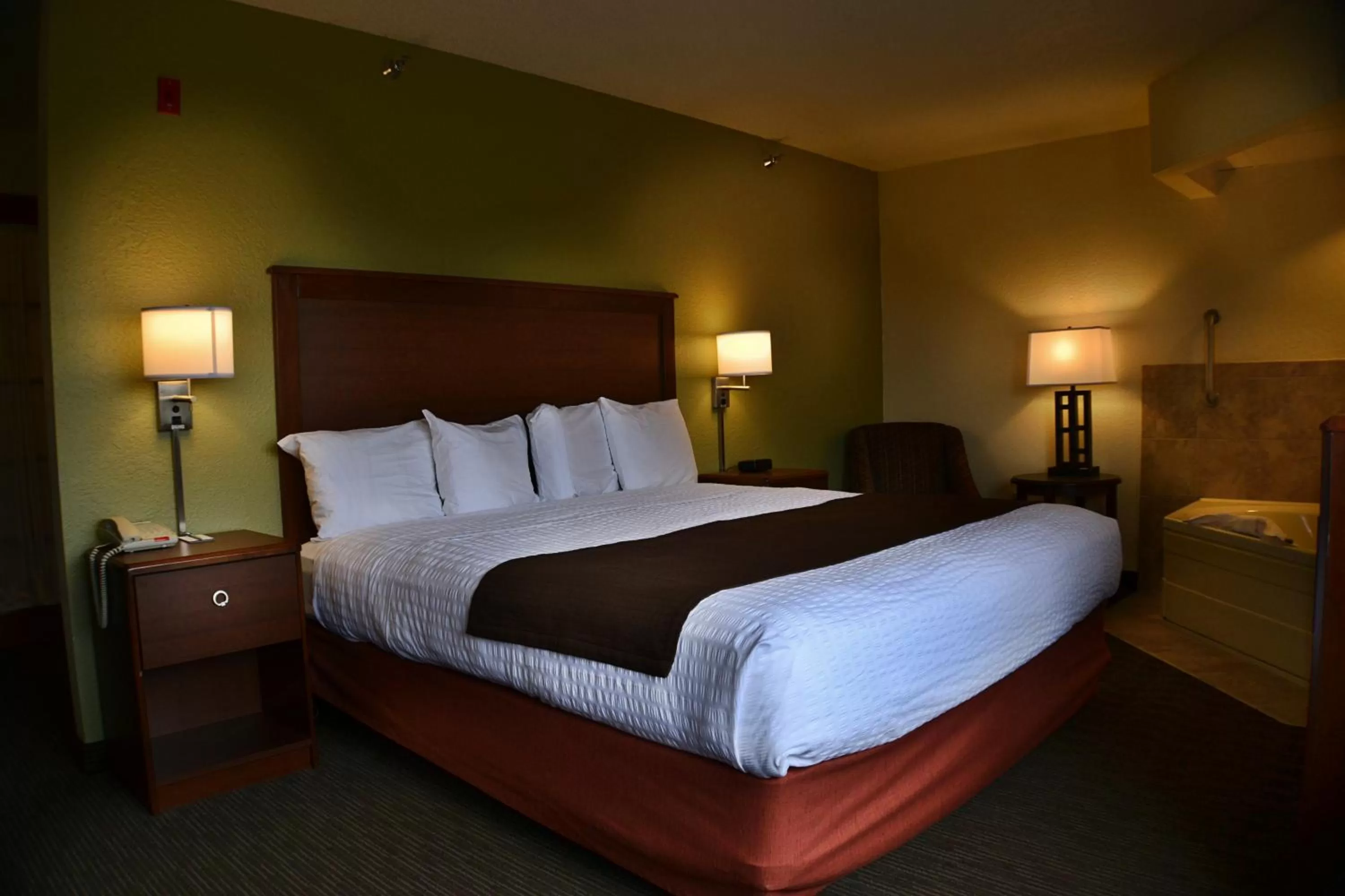 Bed in AmericInn by Wyndham Calumet