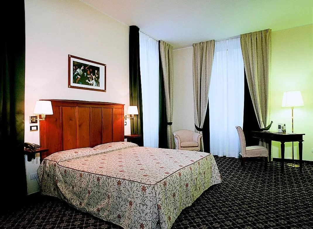 Bed in Hotel Candiani