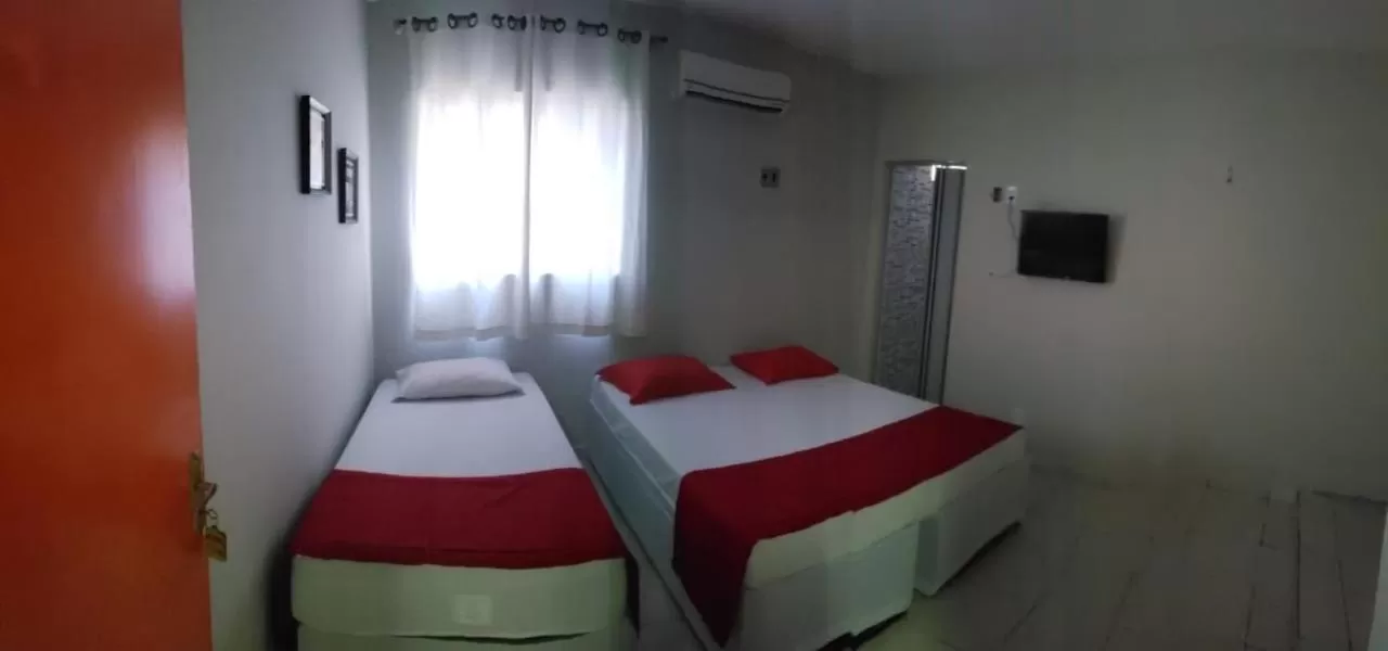 Bed in Nalu Beach Hotel pousada