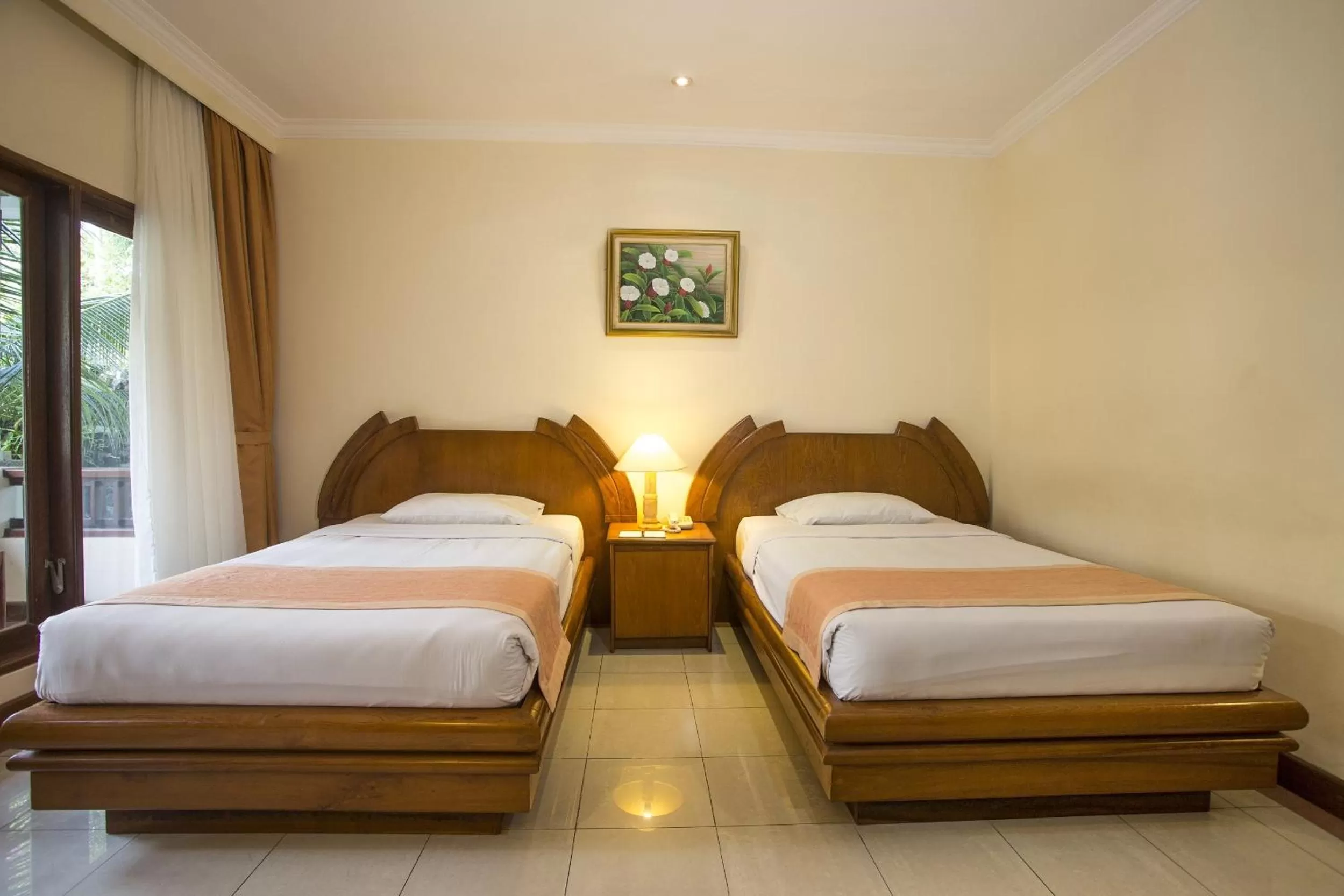 Bed in Parigata Resorts and Spa