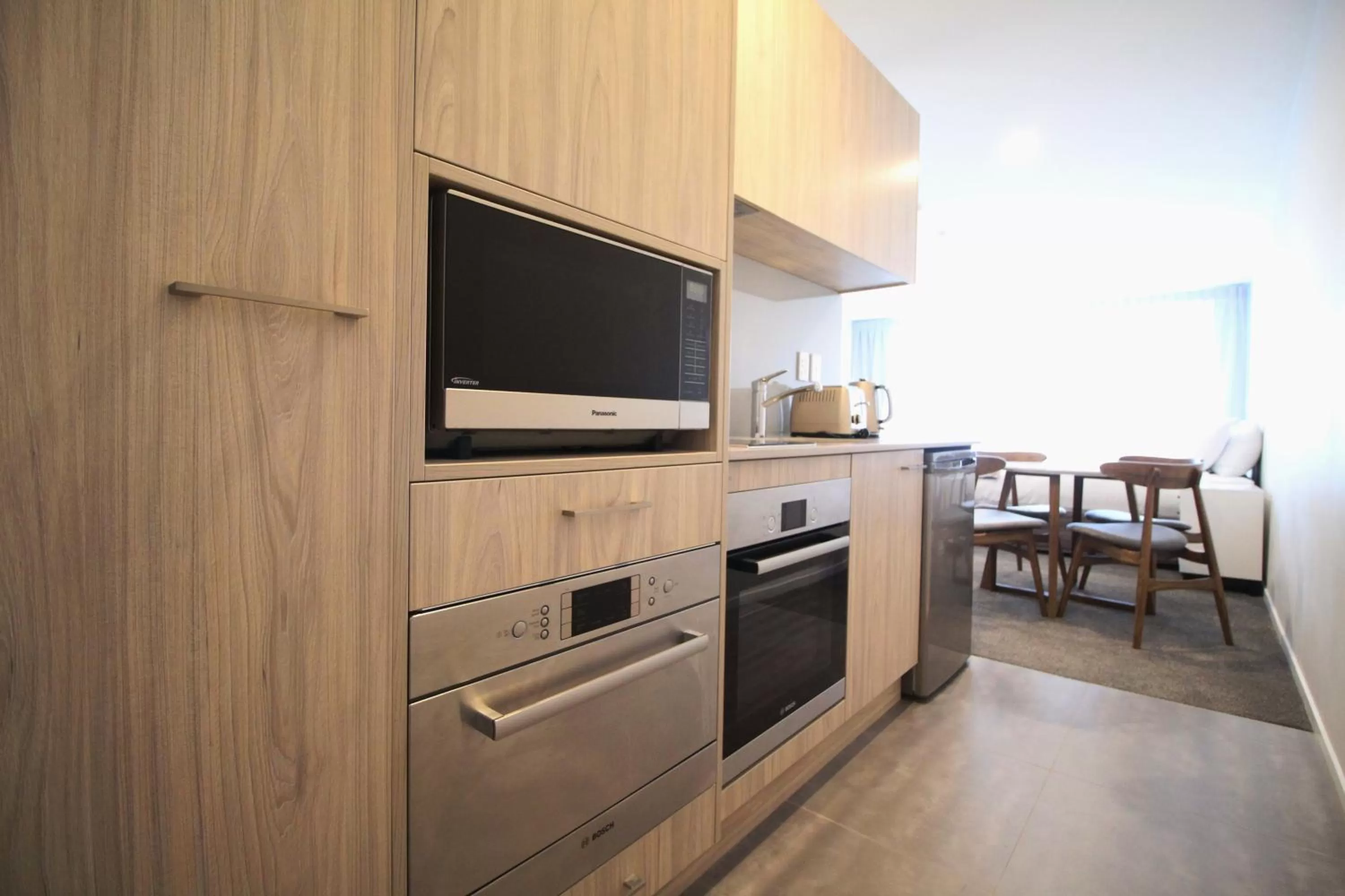Kitchen or kitchenette in FERNZ Motel & Apartments Birkenhead