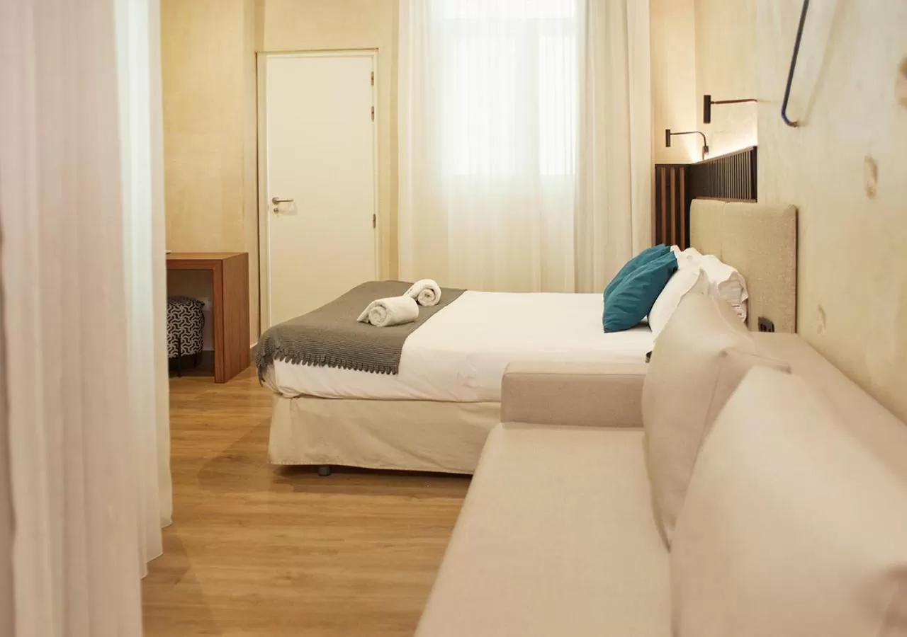 Bed in ISA Sevilla Suites