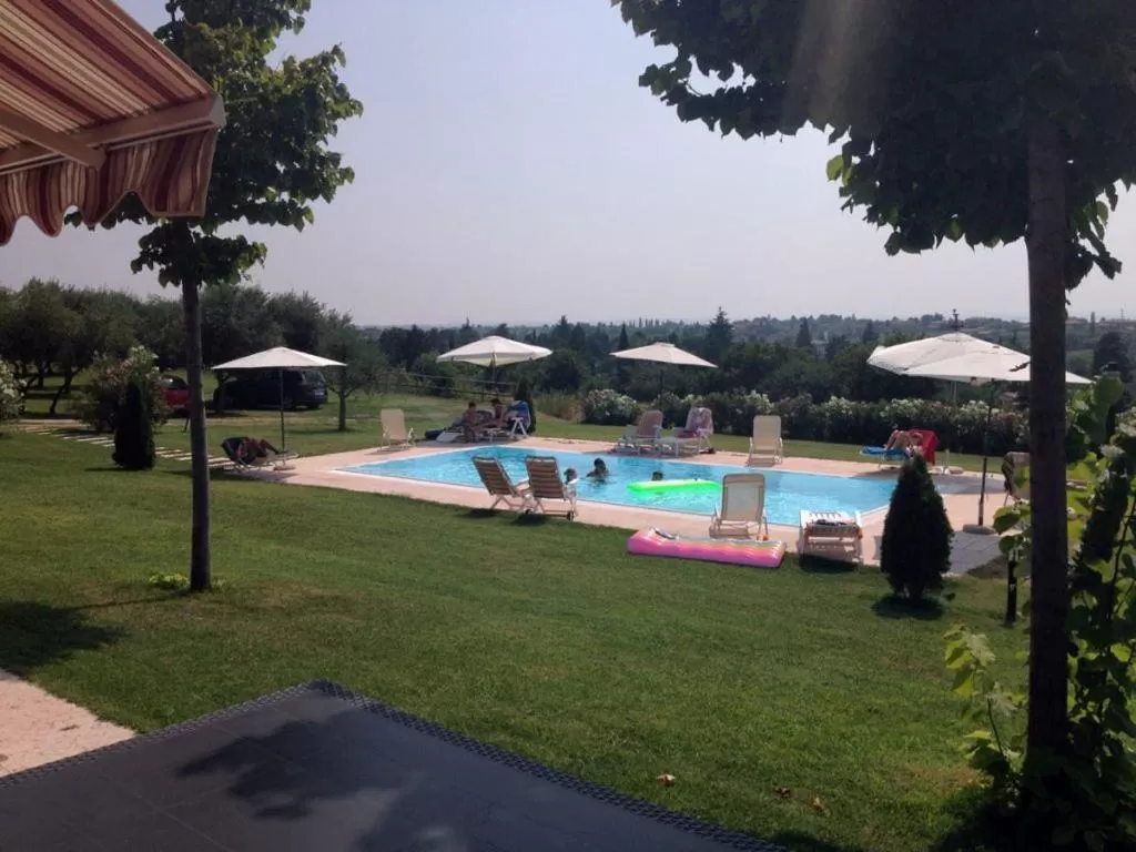 Pool view in AGRITURISMO MELOGRANO D'ORO