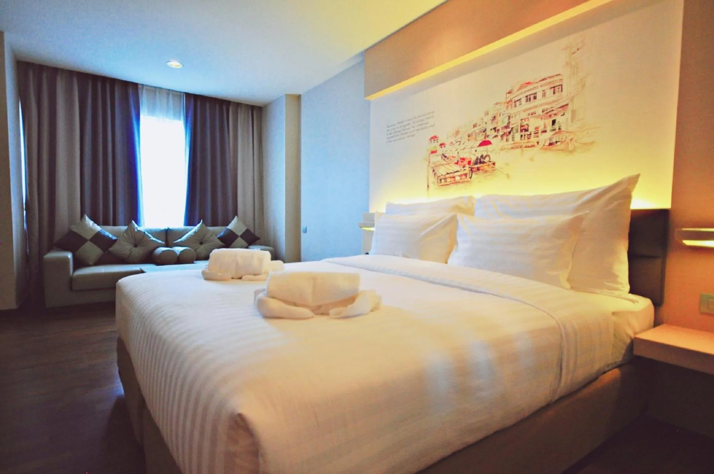 Seating area, Bed in Parinda Hotel