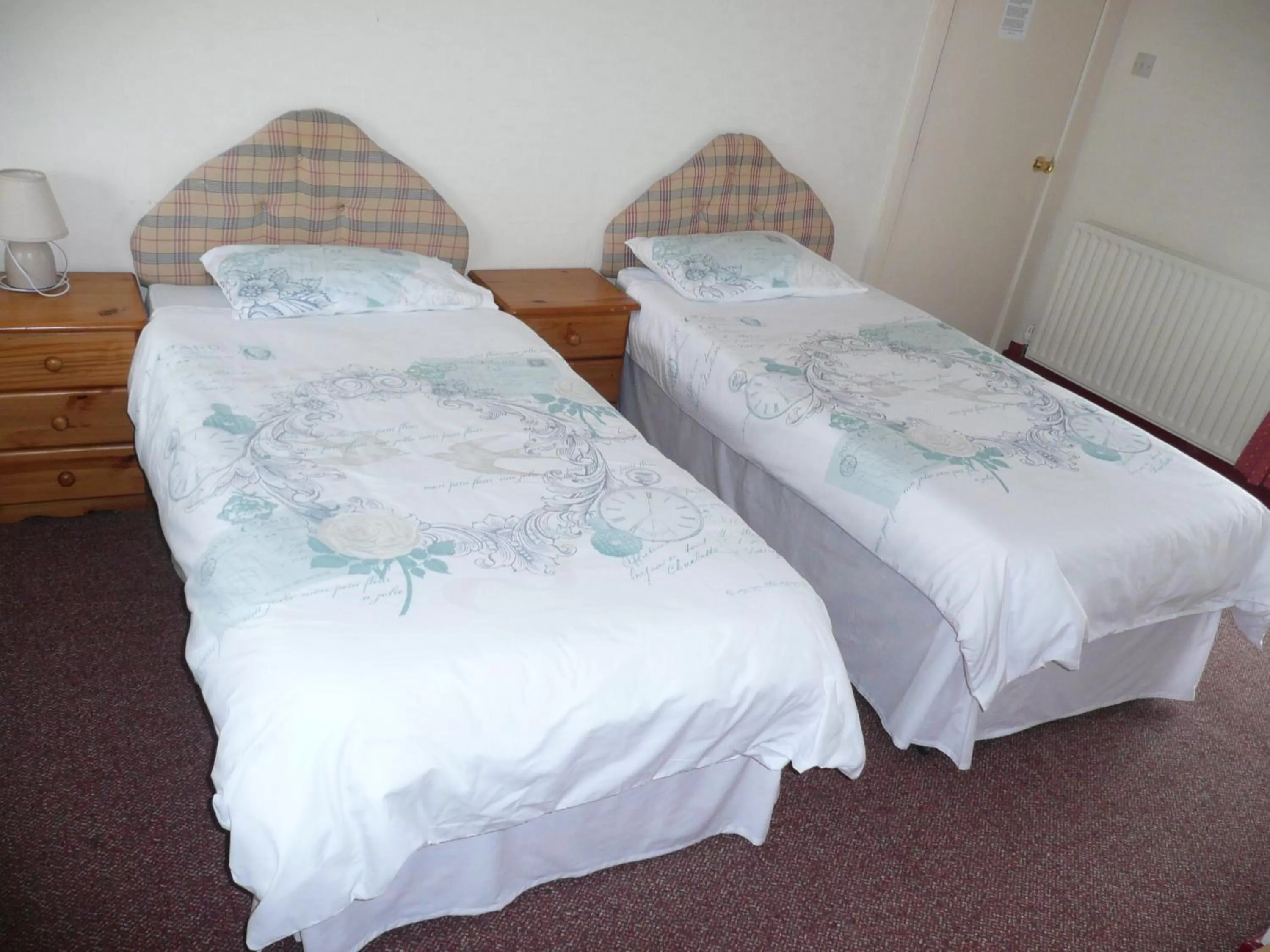 Bed in Beijing Dragon Hotel