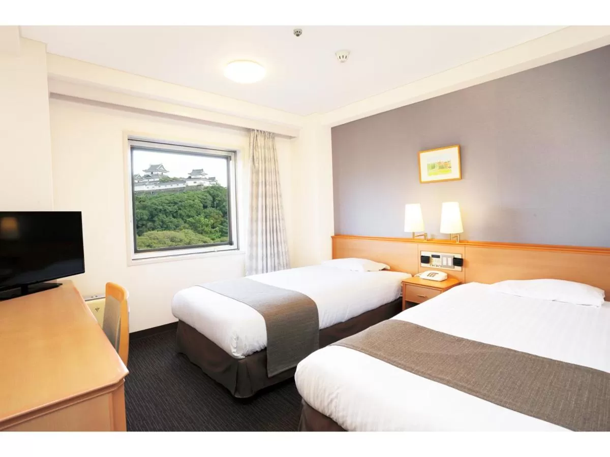 Bed in Smile Hotel Wakayama