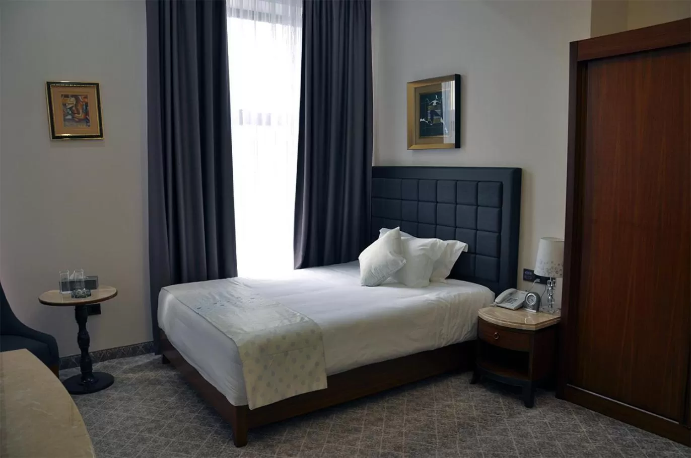 Bed in Parliament Palace Hotel