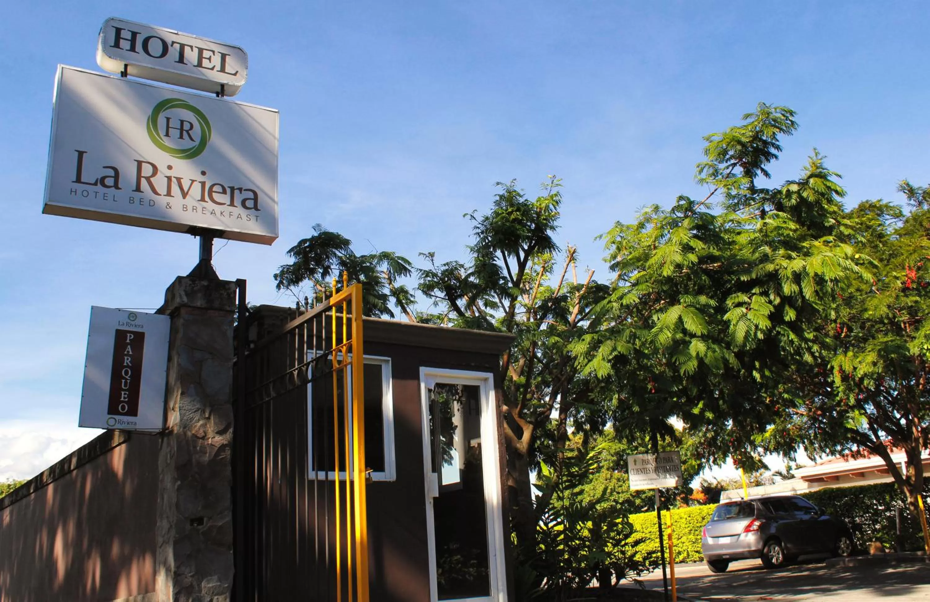 Property logo or sign in La Riviera Hotel