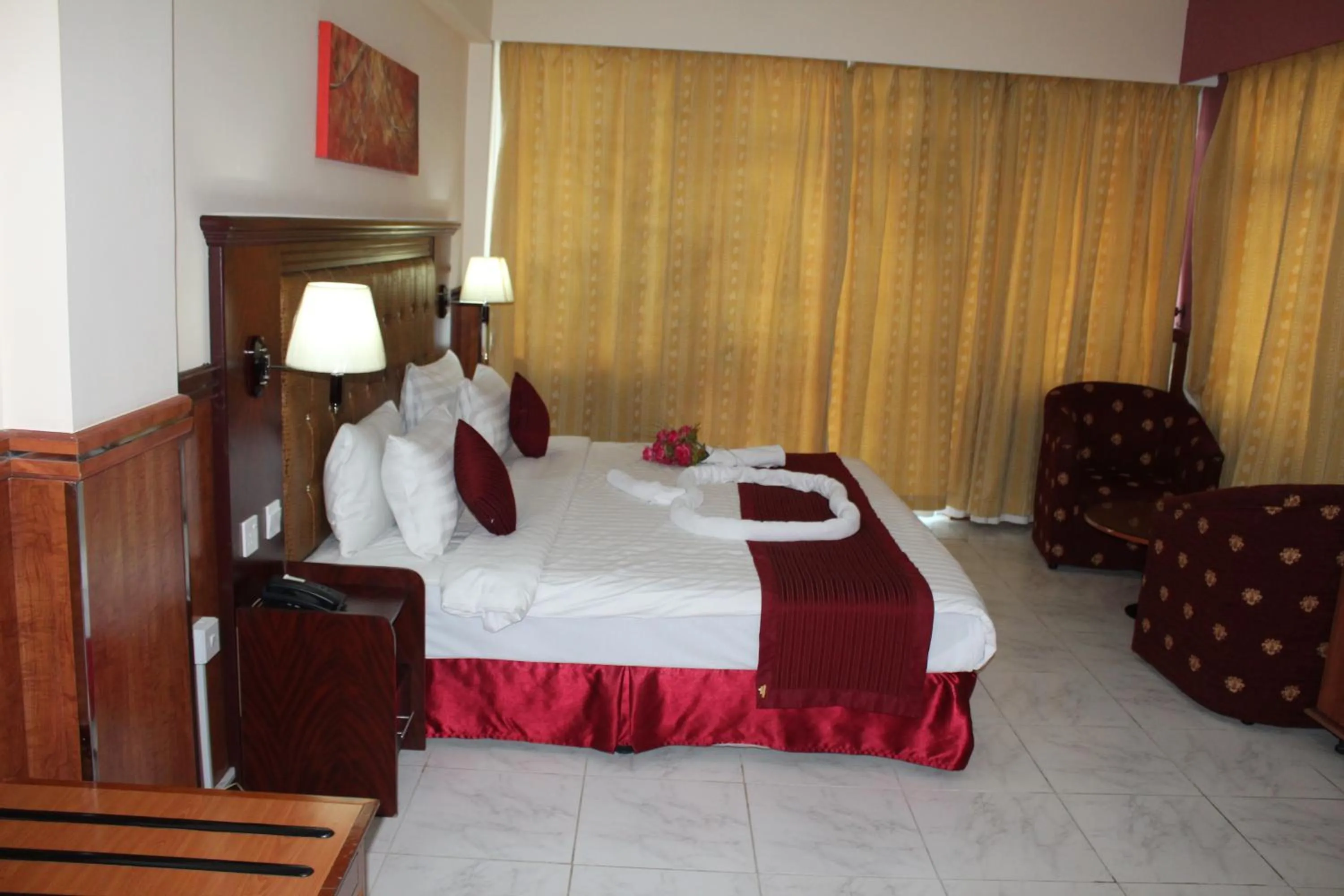 Bed in Grand Nova Hotel