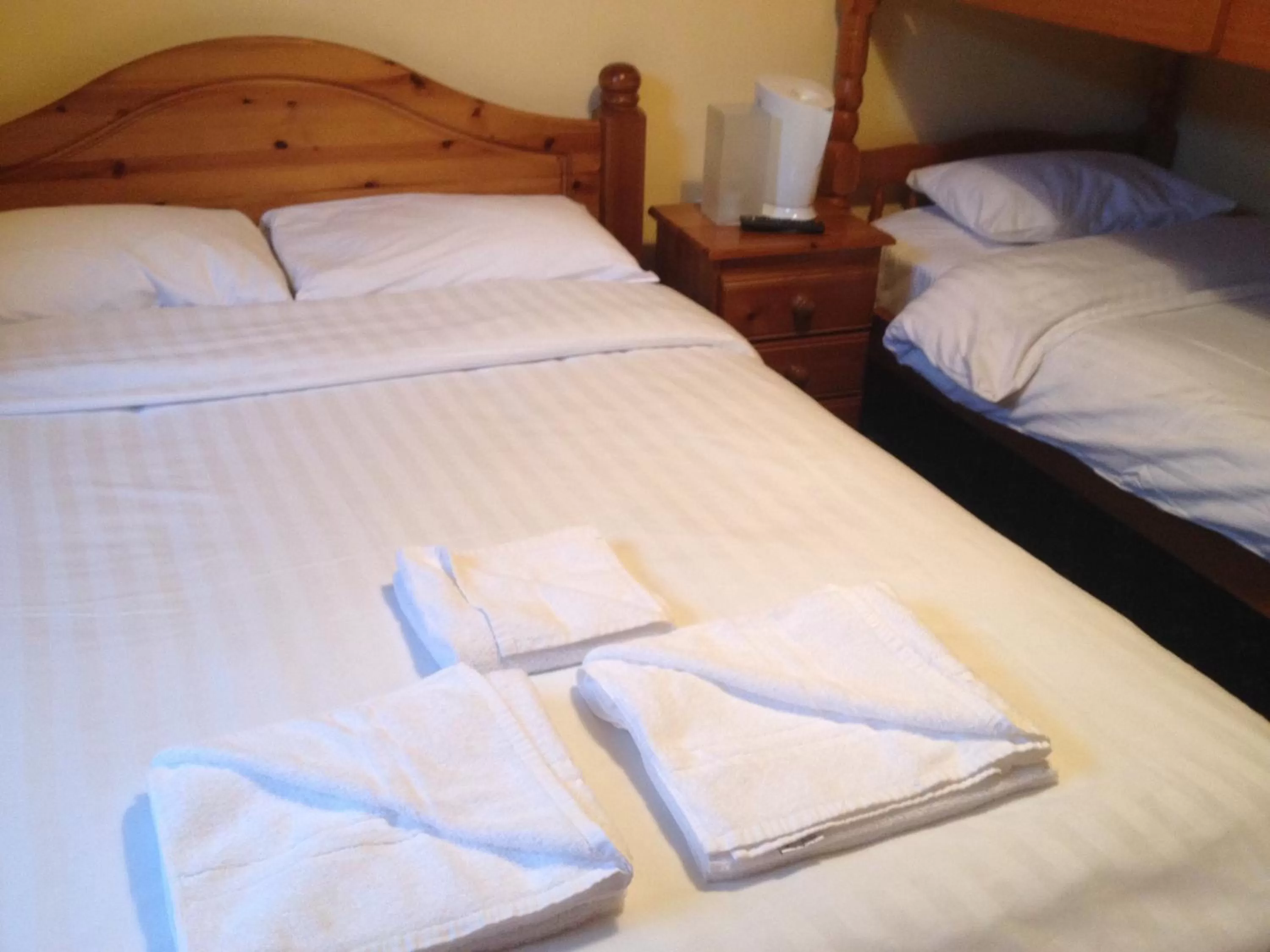 Bed in Twin Lions Hotel