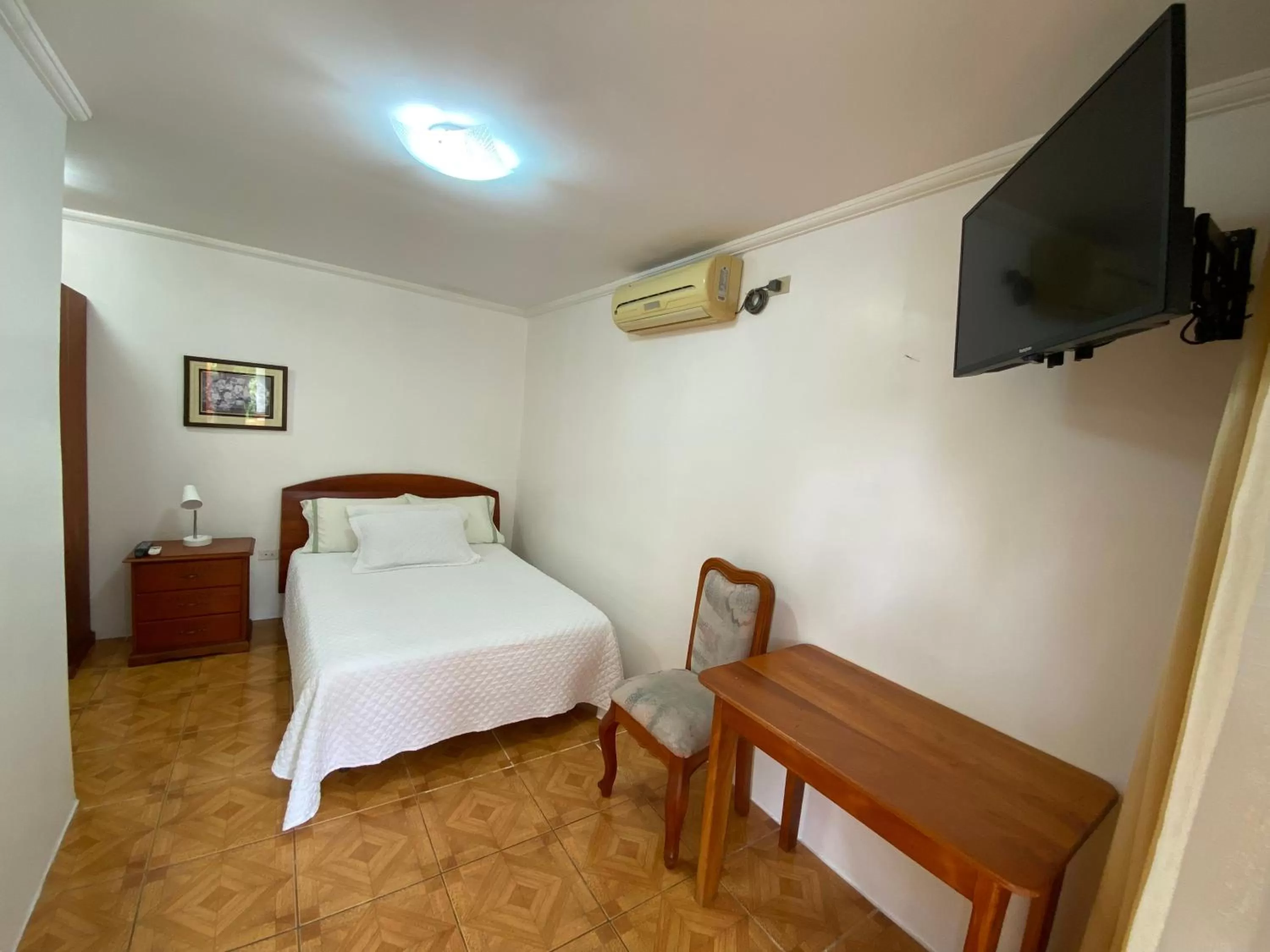 Bed in La Peregrina Galapagos B&B