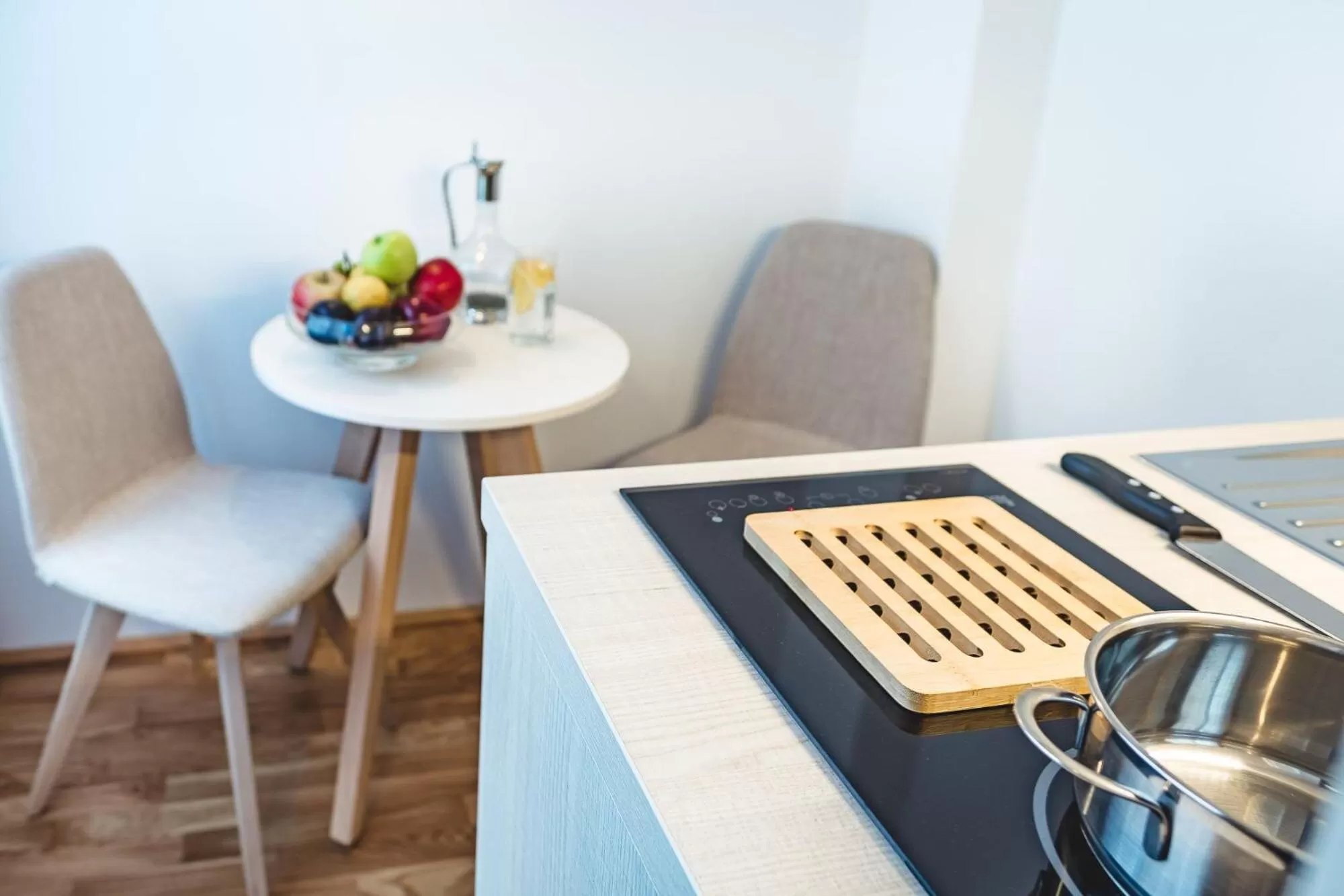 Kitchen or kitchenette in Oliver Apartments | contactless check-in