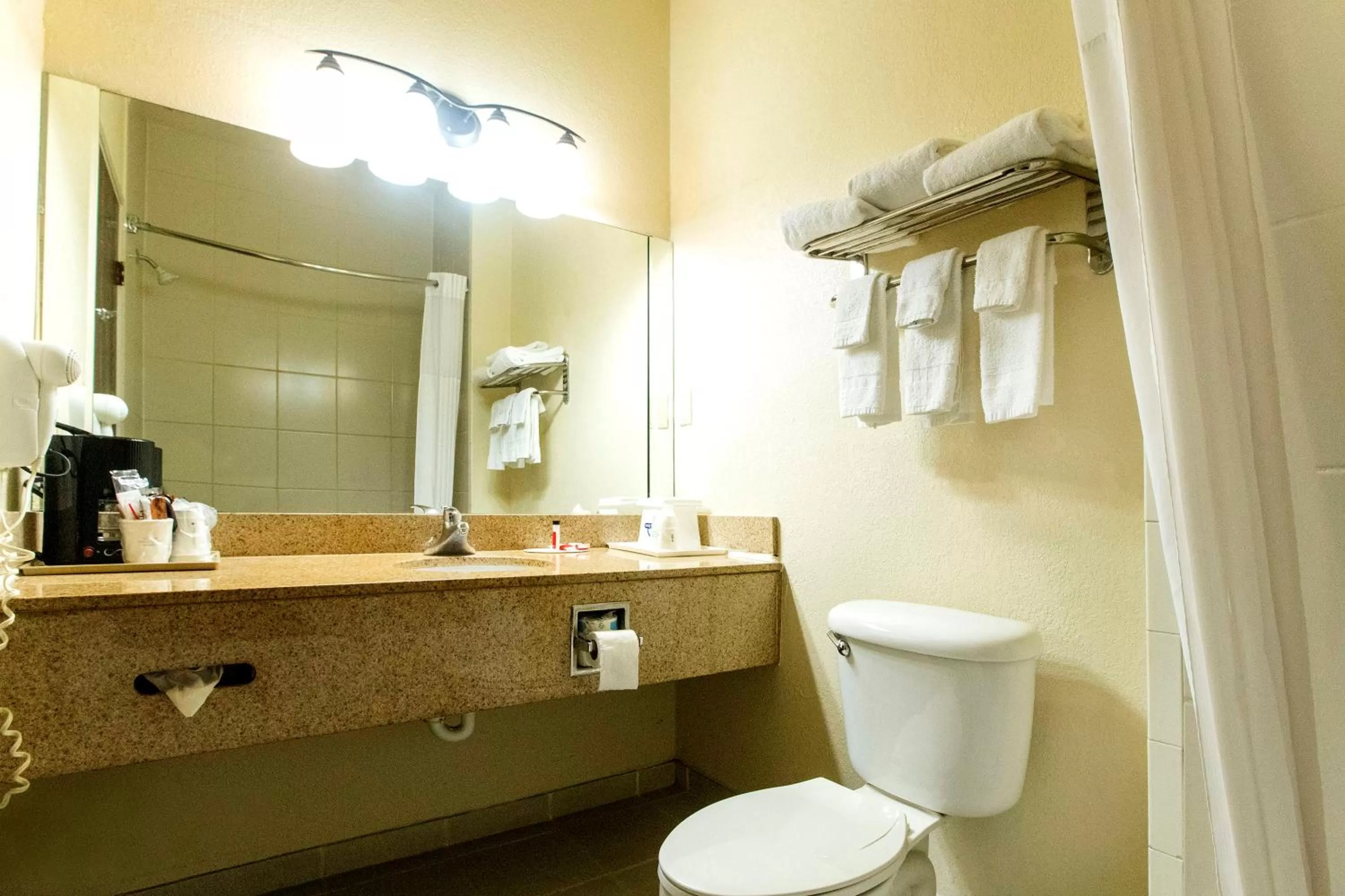 Bathroom in Days Inn & Suites by Wyndham Houston North/Aldine