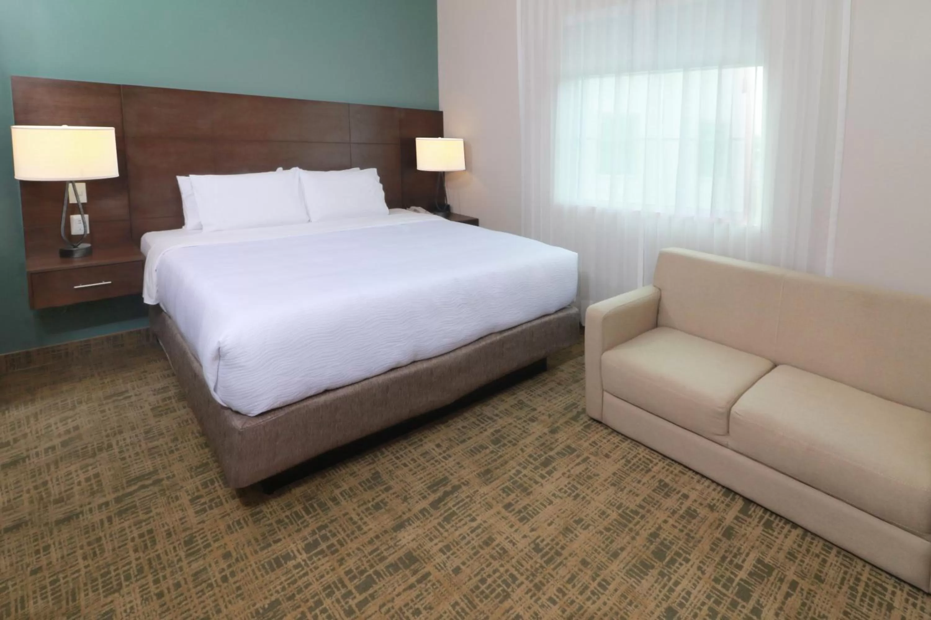 Photo of the whole room, Bed in Staybridge Suites Queretaro by IHG