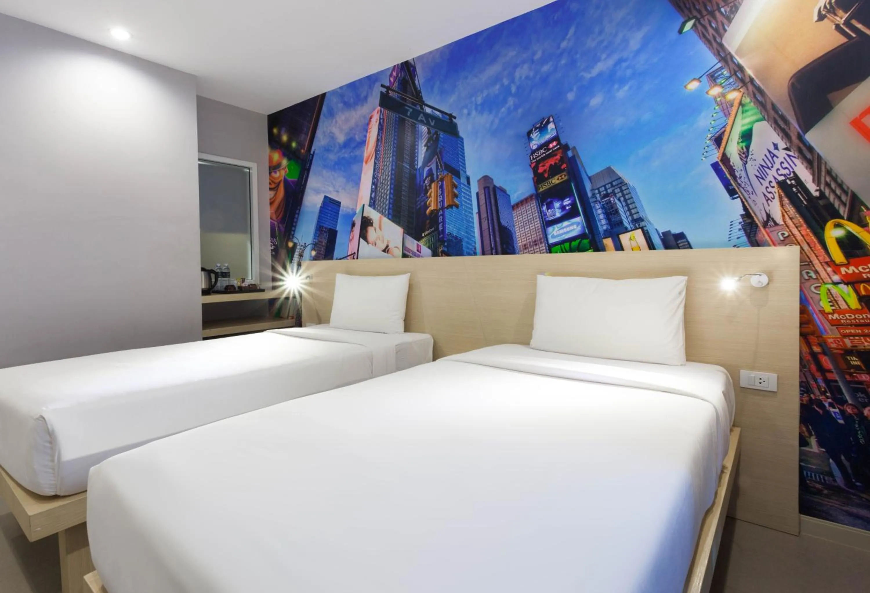 Bed in The AIM Patong Hotel