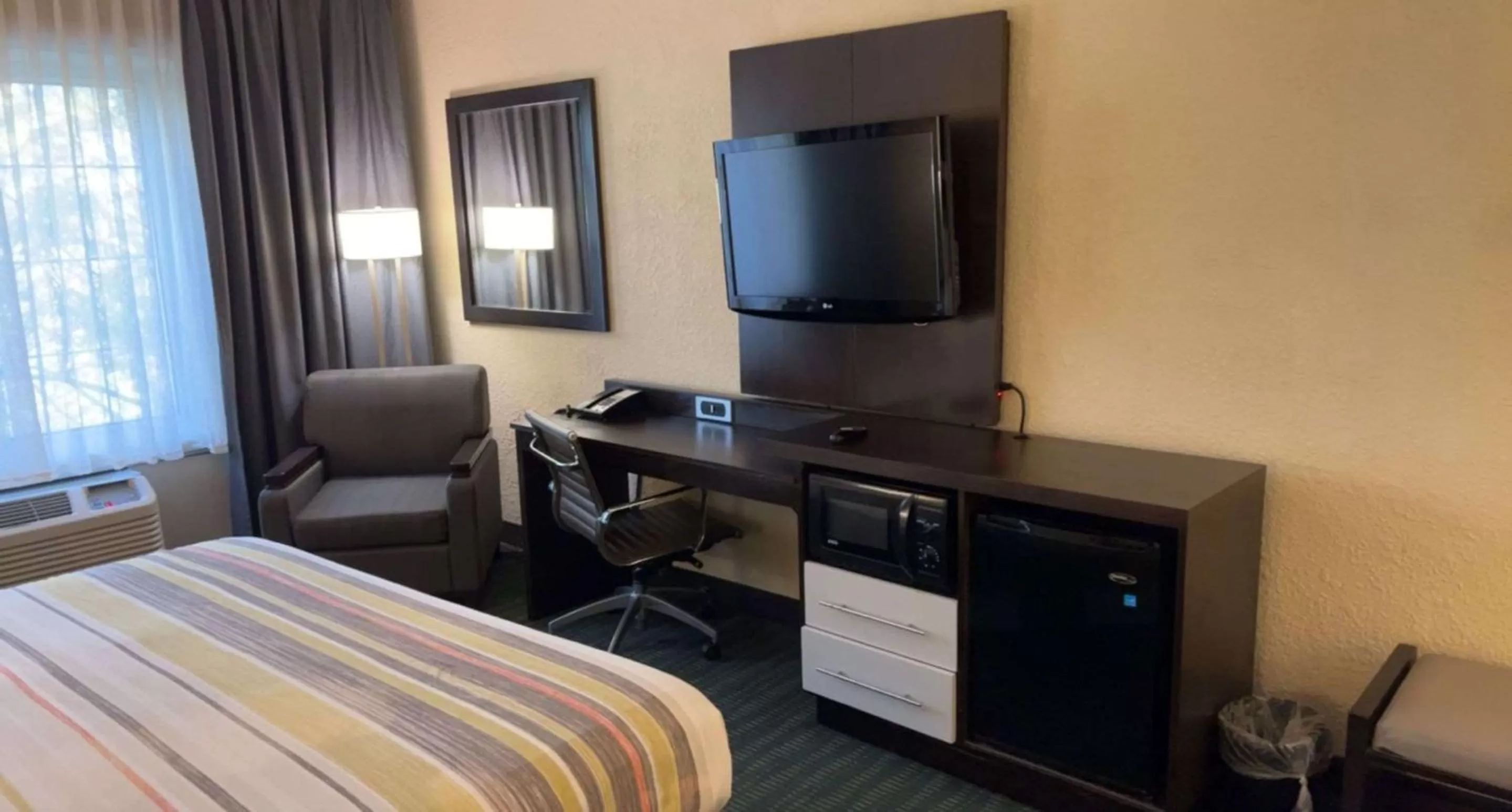 Bedroom, Bed in SureStay Plus Hotel by Best Western Vero Beach